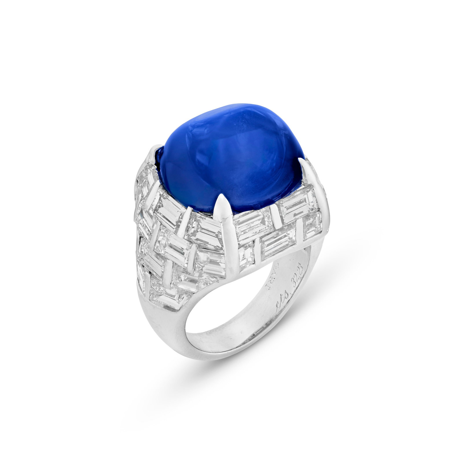 BULGARI SAPPHIRE AND DIAMOND 'TROMBINO' RING: BULGARI SAPPHIRE AND DIAMOND 'TROMBINO' RING Details Cabochon sapphire of 32.24 carats, baguette-cut diamonds, 18k white gold (Italian mark), signed Bvlgari SSEF, 2026, report no. 151749: 32.241 carat