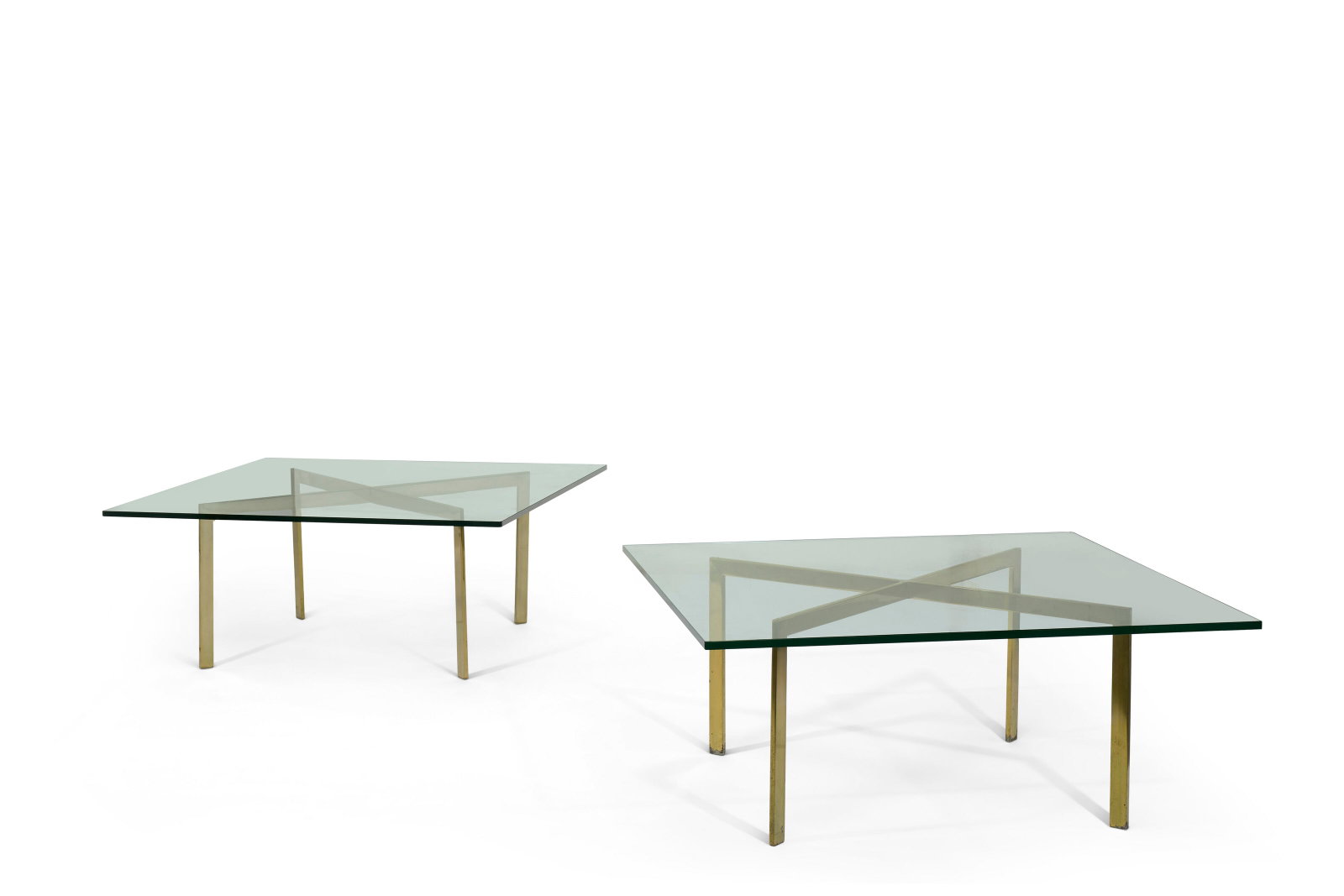 TRAVAIL MODERNE: Details TRAVAIL MODERNE Ensemble de deux tables basses Acier doré et verre Chacune : 42,3 x 101,5 x 101,5 cm / each : 166 ½ x 40 x 40 in(2) Further details A SET OF TWO MODERN METAL AND GLAS