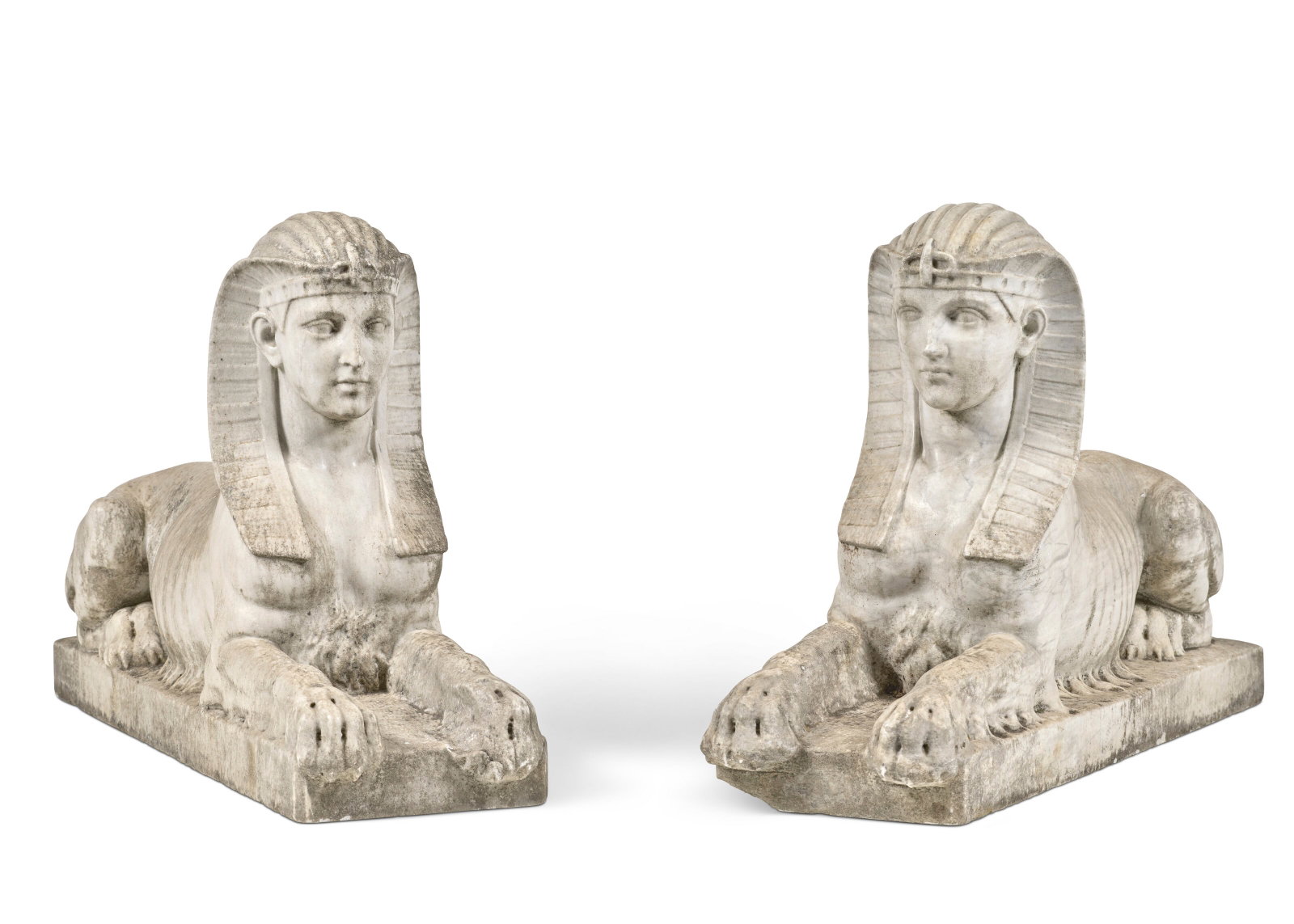 FRANCE, XIXE SIÈCLE: Details FRANCE, XIXE SIÈCLE Paire de sphinges marbre blanc veiné gris H. 45 cm. (17 ¾ in.) ; L. 73 cm. (28 ¾ in.)(2) Further details A PAIR OF MARBLE SPHINXES, 19TH CENTURY