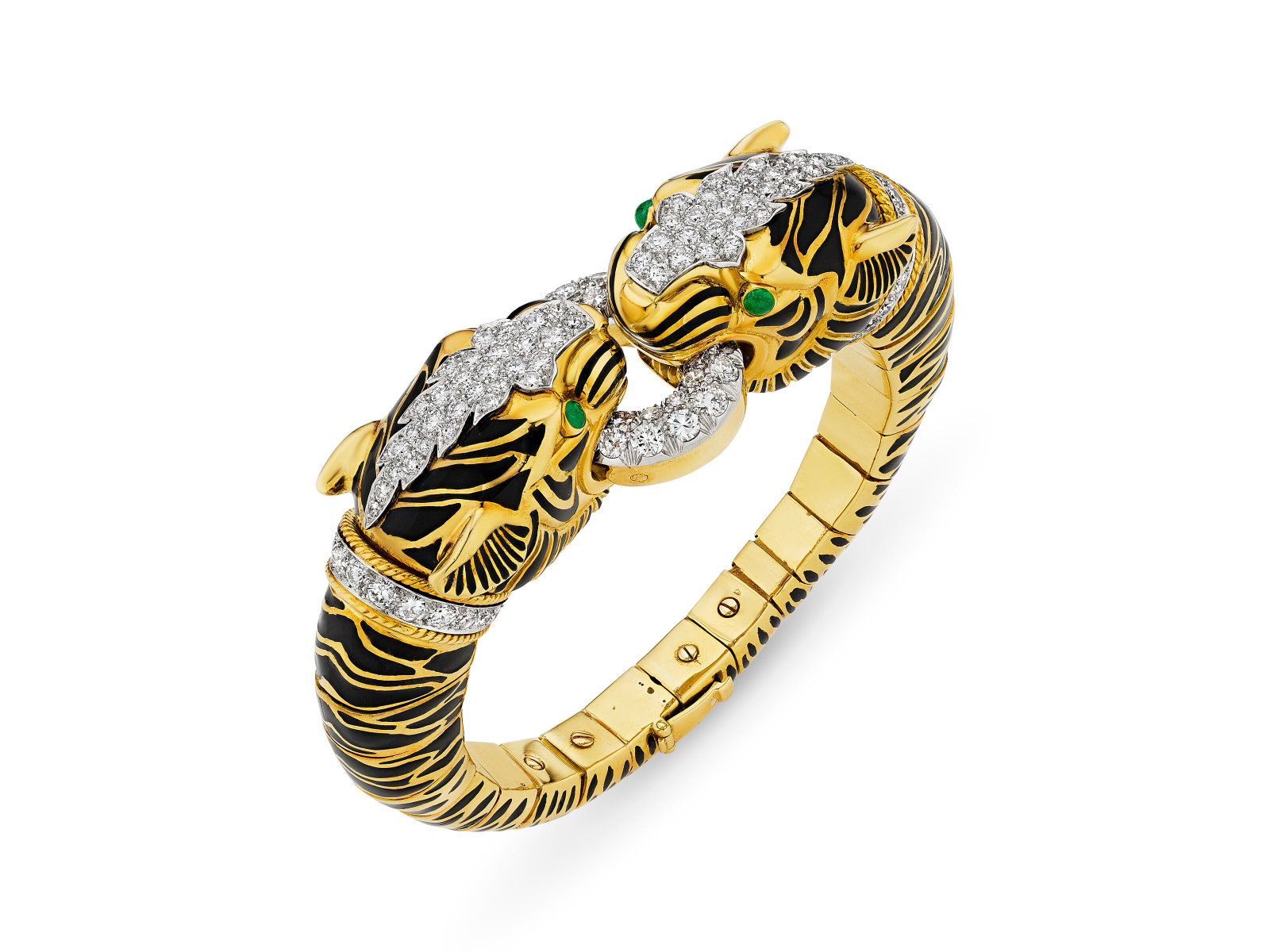 DAVID WEBB ENAMEL, EMERALD AND DIAMOND 'DOUBLE TIGER' BRACELET: Details DAVID WEBB ENAMEL, EMERALD AND DIAMOND 'DOUBLE TIGER' BRACELET Designed as opposing tiger heads, black enamel, round emerald cabochons, round diamonds, 18k yellow gold and platinum, signed Web