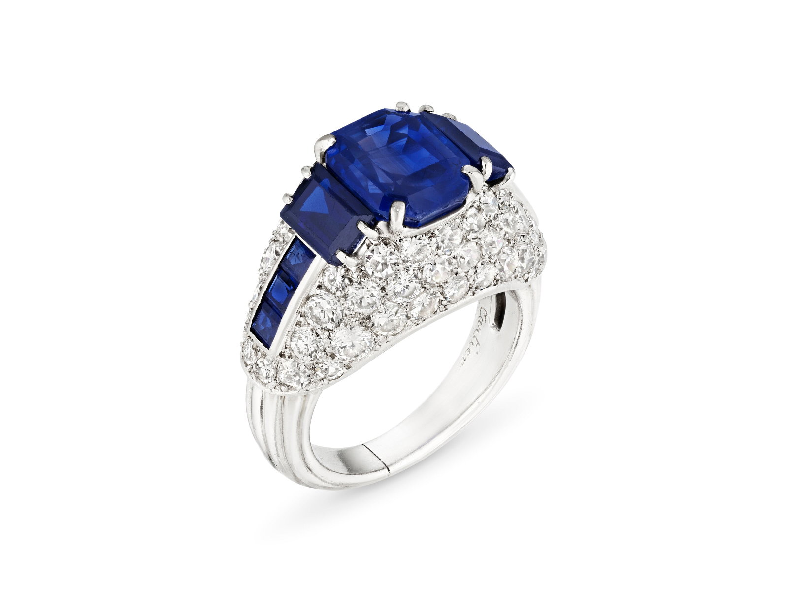 SAPPHIRE AND DIAMOND RING, MOUNTED BY CARTIER: Details SAPPHIRE AND DIAMOND RING, MOUNTED BY CARTIER Octagonal step-cut sapphire of 5.13 carats, rectangular and square sapphires, round diamonds, platinum (French mark), circa 1955, signed Monture C