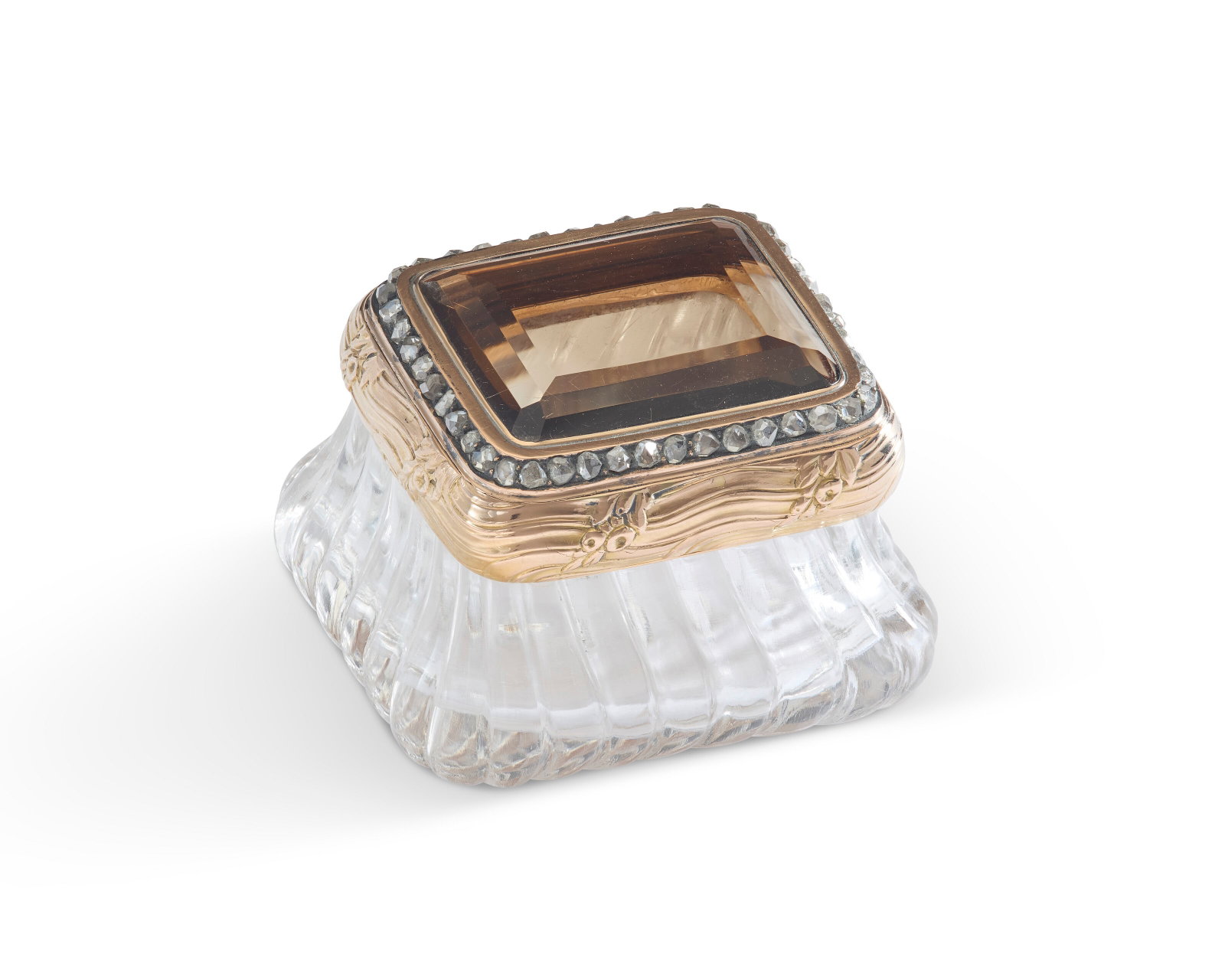 A JEWELED GOLD-MOUNTED SMOKY QUARTZ AND ROCK CRYSTAL BONBONNIÈRE BY FABERGÉ, WORKMASTER: Details A JEWELED GOLD-MOUNTED SMOKY QUARTZ AND ROCK CRYSTAL BONBONNIÈRE BY FABERGÉ, WORKMASTER MICHAEL PERCHIN, ST. PETERSBURG, CIRCA 1890 Rectangular, the rock crystal body of bombé f