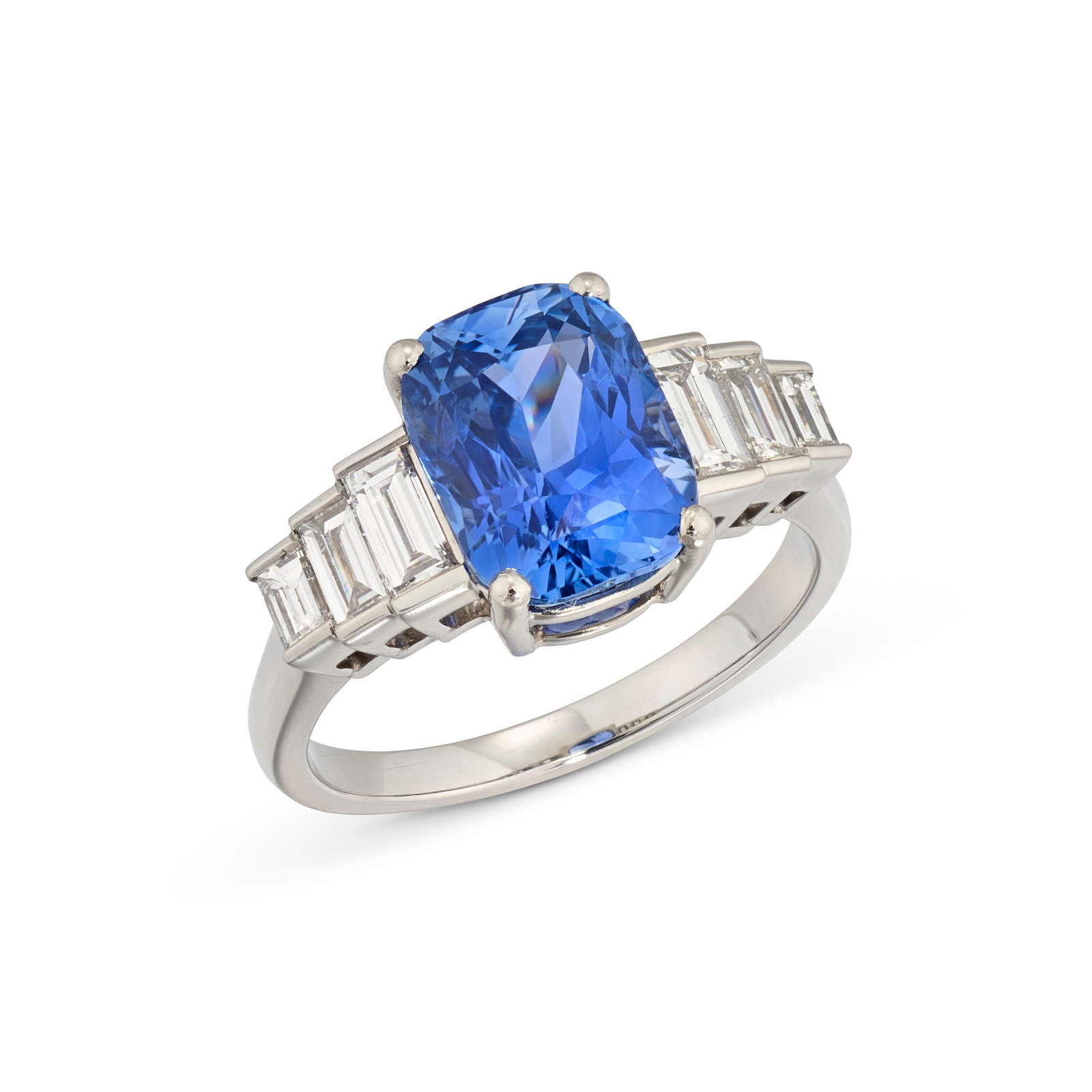 SAPPHIRE AND DIAMOND RING: Details Cushion-shaped sapphire stated to weigh 4.26 carats, baguette-cut diamonds Size/Dimensions: UK ring size L1⁄2 Gross Weight: 6.6 grams