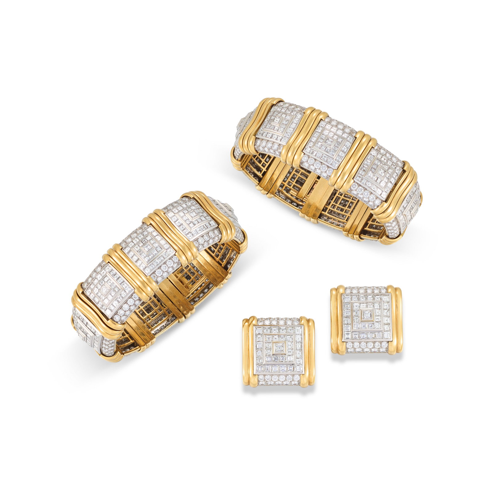 Details Comprising a pair of bracelets and a pair of earrings Circular- and carré-cut diamonds: Details Comprising a pair of bracelets and a pair of earrings Circular- and carré-cut diamonds Size/Dimensions: bracelets each 19.0 cm, earrings 2.8 x 2.7 cm Gross Weight: 438.0 grams