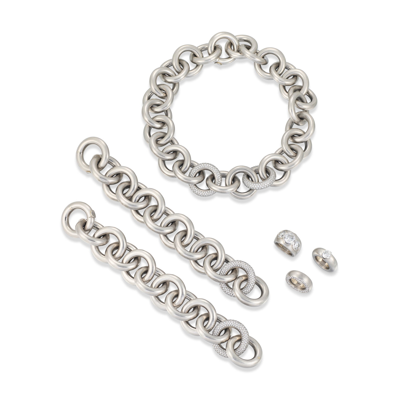 GROUP OF DIAMOND JEWELLERY: Details Comprising a necklace with two bracelets and three diamond rings The necklace and bracelets with circular-cut diamonds, maker's marks (Günter Krauss), may be joined to form a longchain