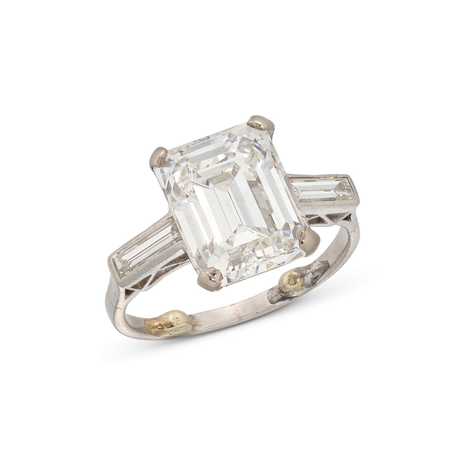 DIAMOND RING: Details Emerald-cut diamond of 4.92 carats, baguette-cut diamonds GIA, 2019, report no. 2201642913: 4.92 carats, F colour, VS2 clarity Size/Dimensions: UK ring size F (with integrated sizing beads)
