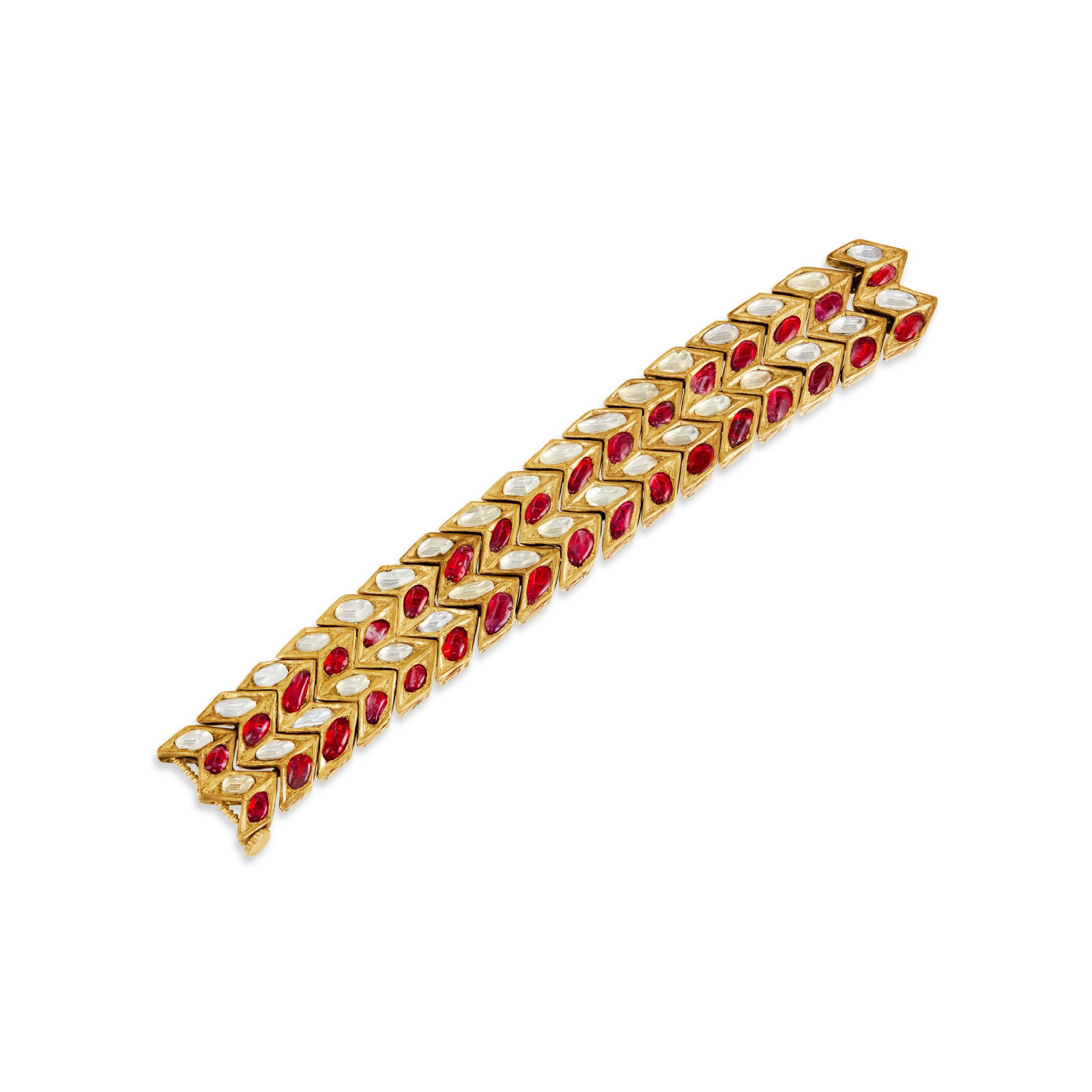 INDIAN RUBY, COLORLESS SAPPHIRE AND ENAMEL BRACELET: INDIAN RUBY, COLORLESS SAPPHIRE AND ENAMEL BRACELET Details Variously-shaped foil-backed rubies and colorless sapphires, red, green, white and blue enamel, yellow gold on a lac core Size/Dimensions: