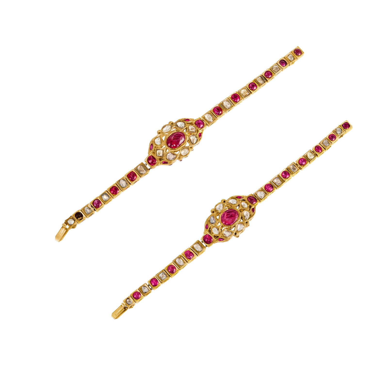PAIR OF INDIAN RUBY, DIAMOND AND ENAMEL BRACELETS: PAIR OF INDIAN RUBY, DIAMOND AND ENAMEL BRACELETS Details Round and oval-shaped polished rubies, table-cut diamonds, enamel, yellow gold, one bracelet deficient one ruby Size/Dimensions: 17.7 cm (7