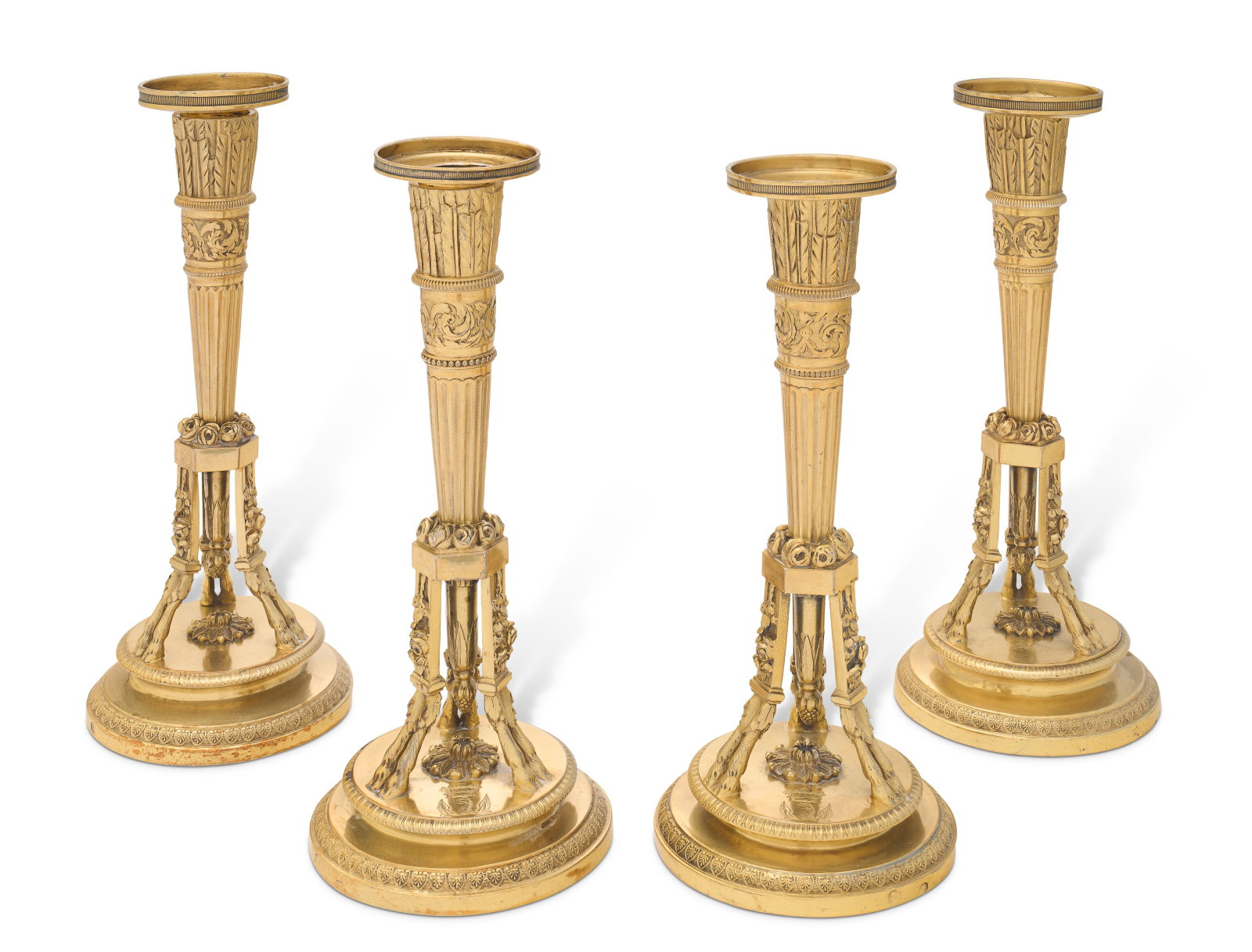 TWO PAIRS OF FRENCH SILVER-GILT CANDLESTICKS MARK OF PIERRE PARAUD, PARIS, 1800-1809 (1 of 4)