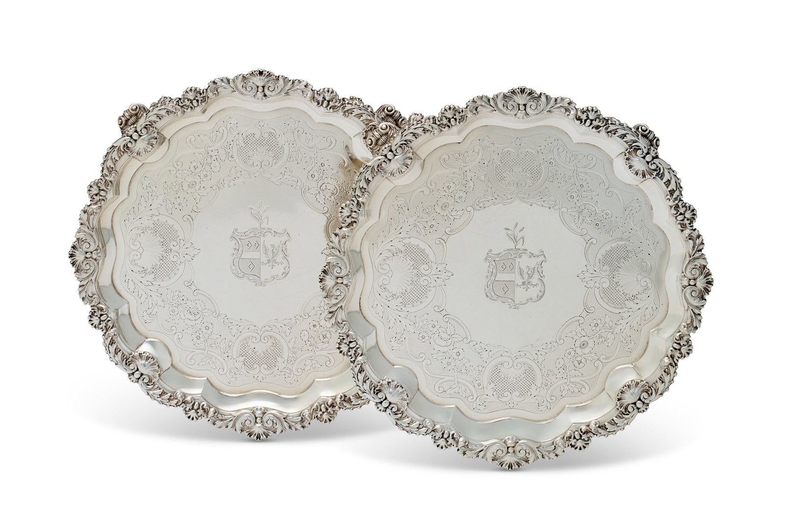 A PAIR OF GEORGE IV SILVER SALVERS MARK OF PAUL STORR, LONDON, 1820: A PAIR OF GEORGE IV SILVER SALVERS MARK OF PAUL STORR, LONDON, 1820 Details Each shaped circular with shell and acanthus border, on four shell and scroll feet flanked by pendant grape bunches, the sur