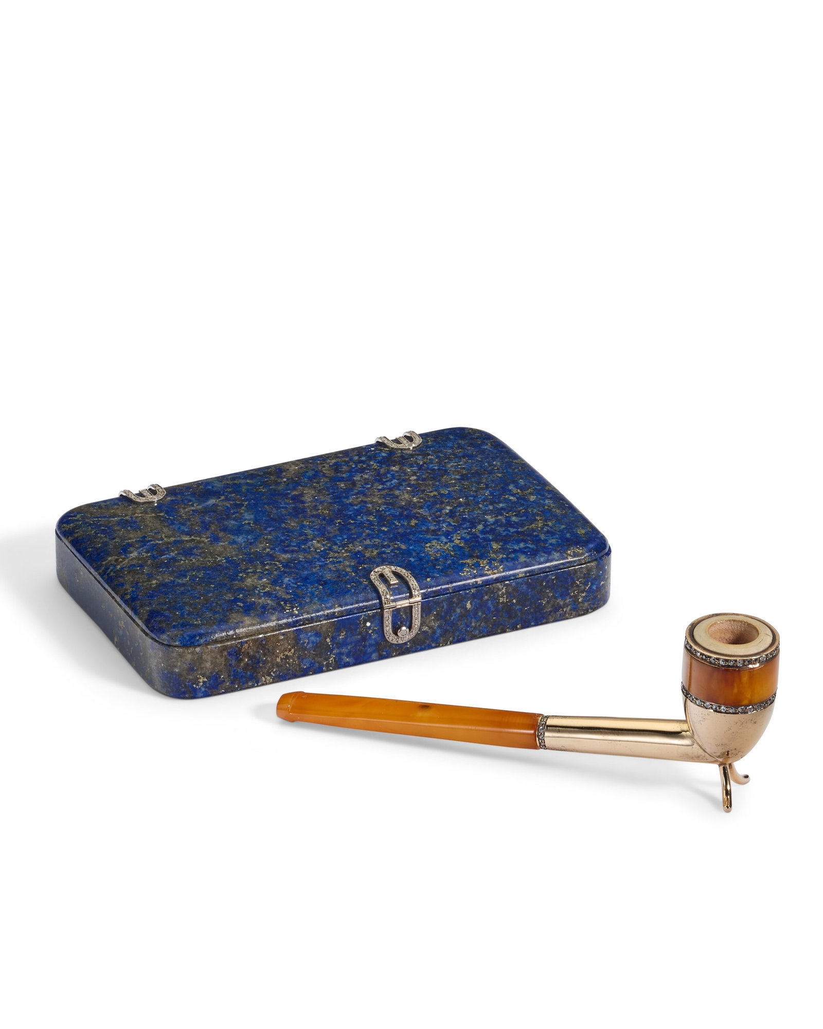 A CONTINENTAL DIAMOND AND PLATINUM-MOUNTED LAPIS LAZULI CIGARETTE CASE AND GOLD-MOUNTED AMBER PIPE (1 of 1)