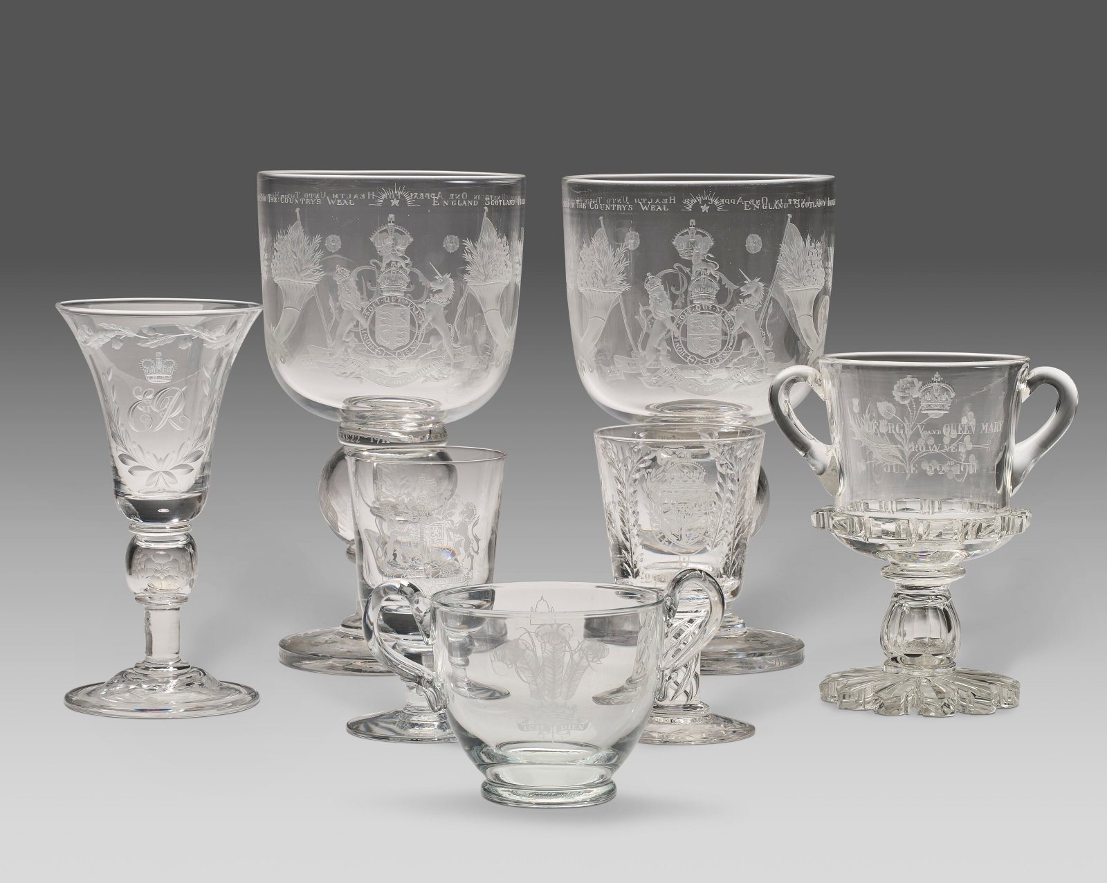 A PAIR OF LARGE ENGLISH ENGRAVED GLASS GOBLETS COMMEMORATING GEORGE V'S 'SILVER JUBILEE' DATED 1935, (1 of 4)