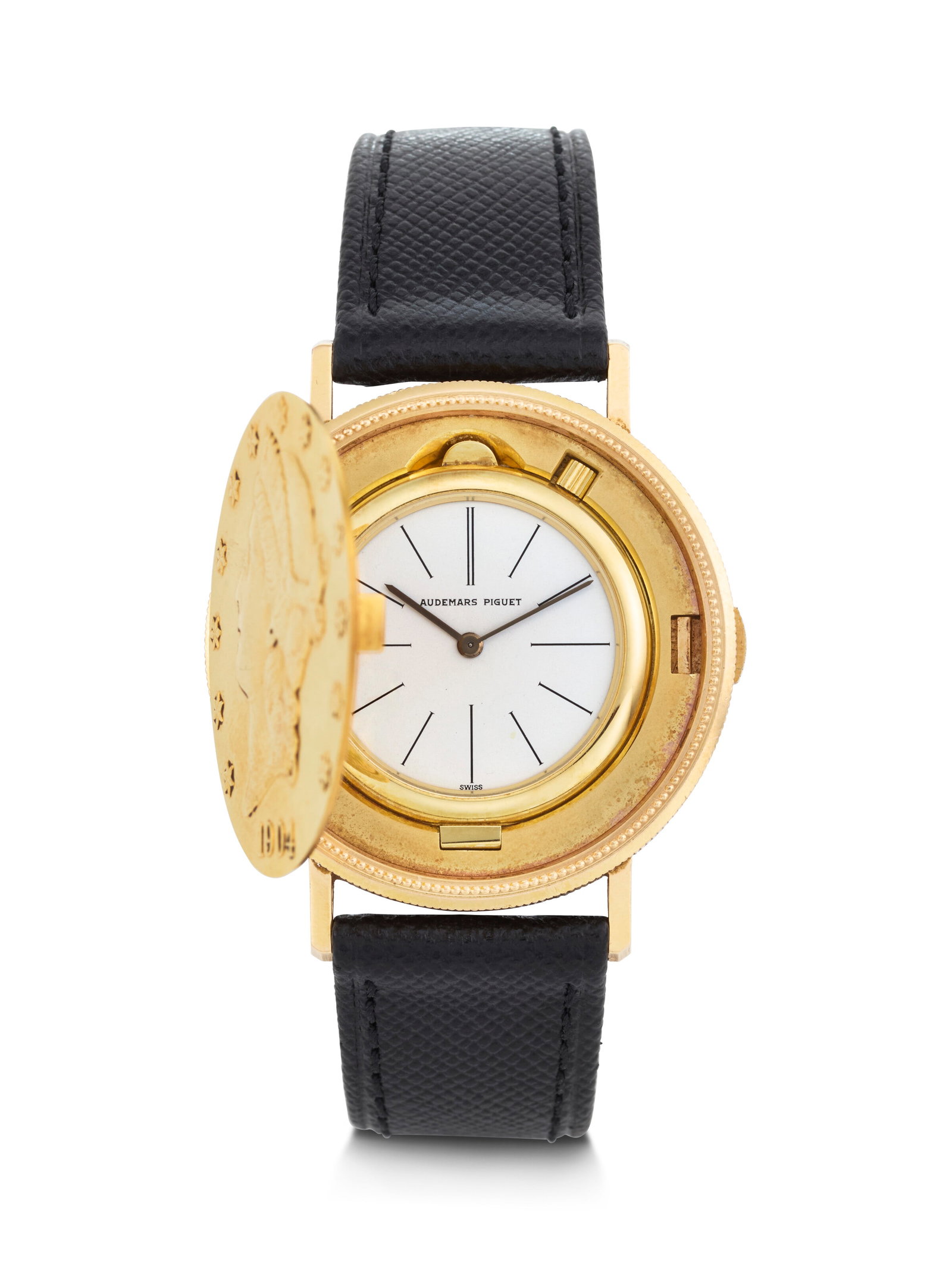 AUDEMARS PIGUET. A RARE AND UNUSUAL 18K GOLD TWENTY DOLLAR COIN CONCEALED WRISTWATCH WITH HINGED: AUDEMARS PIGUET. A RARE AND UNUSUAL 18K GOLD TWENTY DOLLAR COIN CONCEALED WRISTWATCH WITH HINGED CASE COIN WATCH MODEL, REF. 5610BA, MOVEMENT NO. 199’792, CASE NO. B 53091, MANUFACTURED IN 1980 