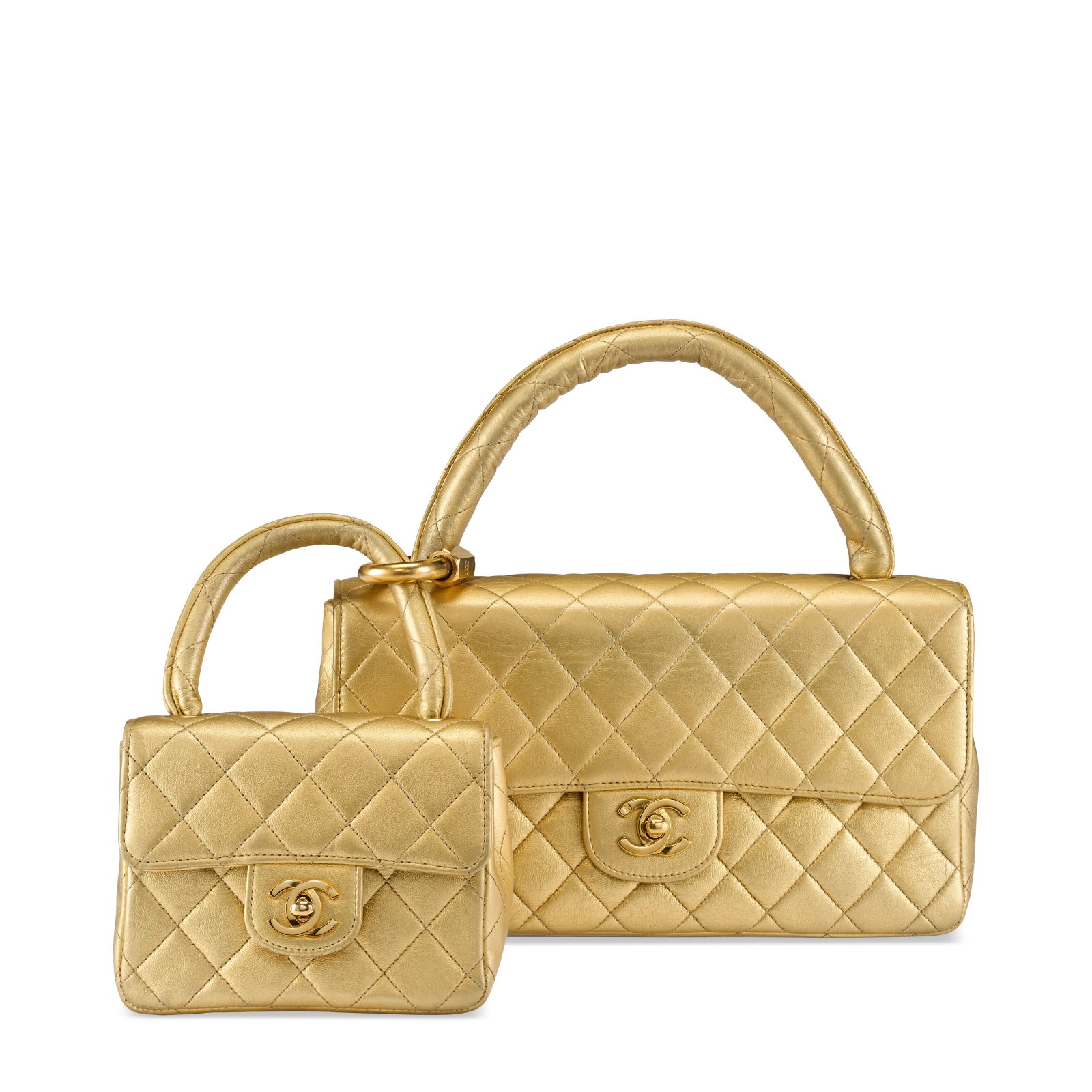 A METALLIC GOLD LAMBSKIN LEATHER MOTHER DAUGHTER FLAP BAG WITH GOLD HARDWARE CHANEL, 1994-1996: Details GRADE: 2.5 Large Flap Bag: 26 w x 14 h x 7.5 d cm Small Flap Bag: 15 w x 11.5 h x 6.5 d cm Includes Christie's dustbag.