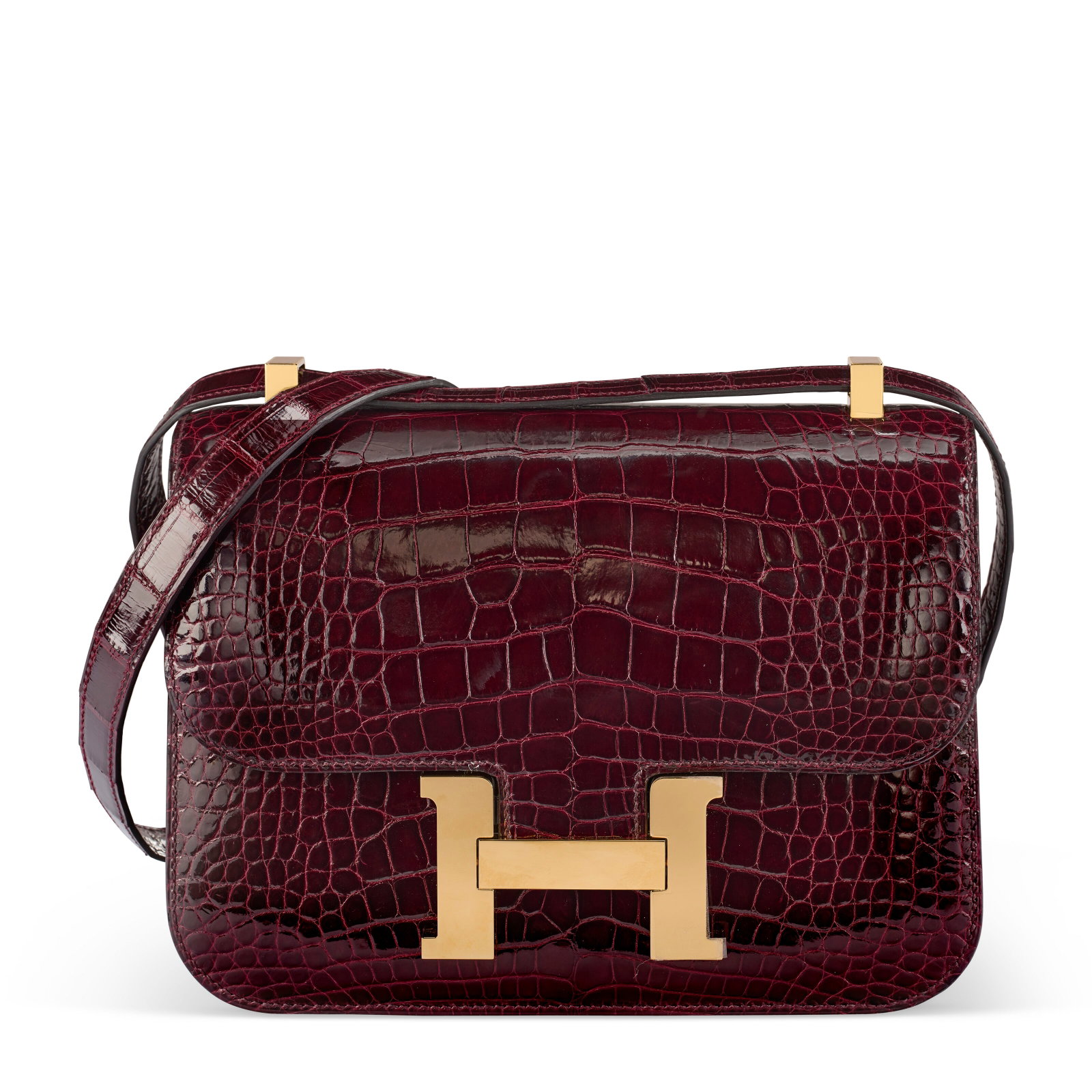 A SHINY BORDEAUX ALLIGATOR MIRROR CONSTANCE I-24 WITH GOLD HARDWARE HERMÈS, 2025: Details GRADE: 2 24 w x 19 h x 7 d cm Includes dust bag, felt protector, care card, and box. FURTHER DETAILS ~CITES Notice Alligator Mississippiensis, Annexe CITES II-B This lot must either be shipped