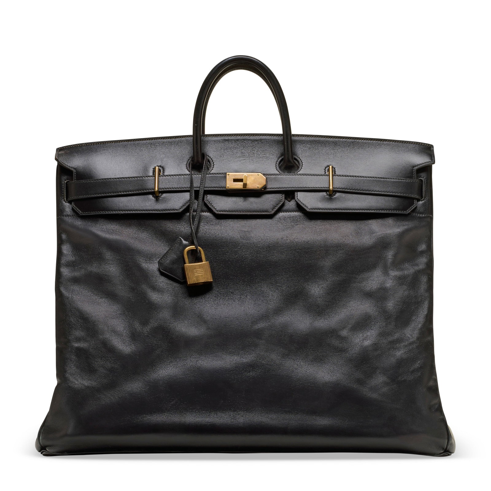 A BLACK CALF BOX LEATHER HAC BIRKIN 55 WITH BRASS HARDWARE HERMÈS, 1986 (1 of 4)
