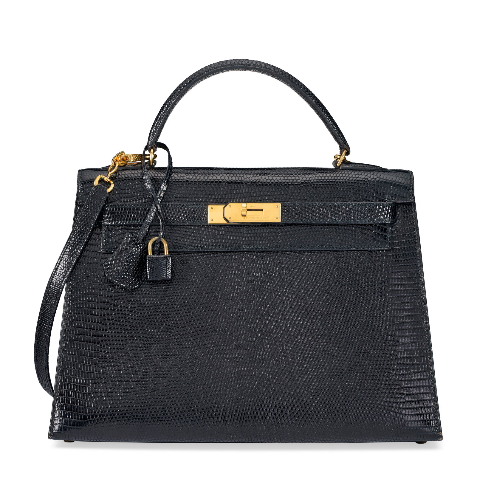 A SHINY BLACK NILOTICUS LIZARD SELLIER KELLY 32 WITH GOLD HARDWARE HERMÈS, 1973 (1 of 4)