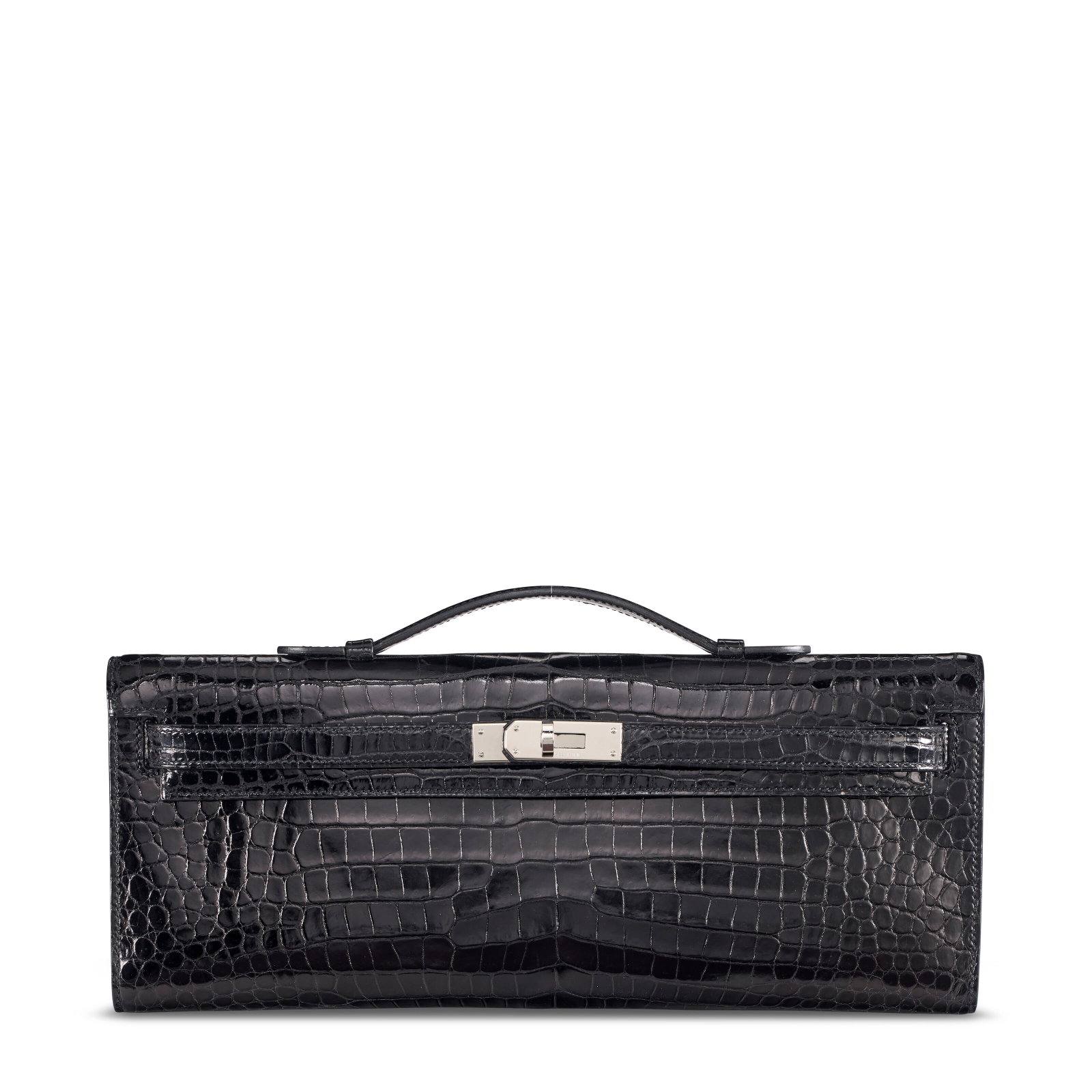A SHINY BLACK POROSUS CROCODILE KELLY CUT WITH PALLADIUM HARDWARE HERMÈS, 2015: Details GRADE: 2.5 30.75 w x 12.5 h x 2 d cm Includes dust bag, felt protector, and box. FURTHER DETAILS ~CITES Notice Crocodylus Porosus, Annexe CITES II-B This lot must either be shipped to its fina