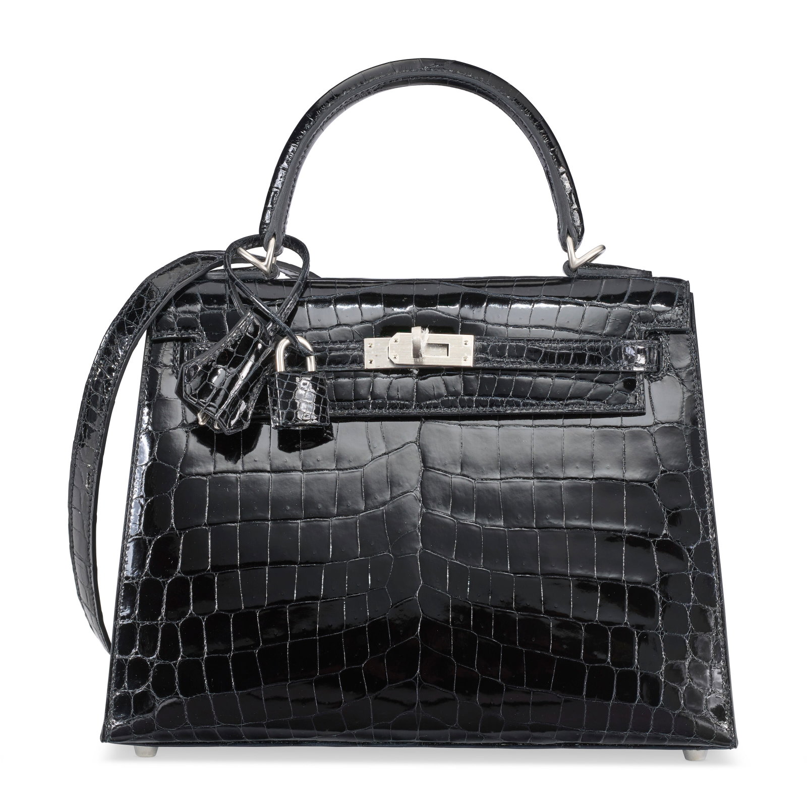 A SHINY BLACK NILOTICUS CROCODILE SELLIER KELLY 25 WITH BRUSHED PALLADIUM HARDWARE HERMÈS, 2025: Details GRADE: 1 25 w x 19 h x 14 d cm Includes lock, keys, clochette, small dust bag, dust bag, felt protector, care card, ribbon, and box. FURTHER DETAILS ~CITES Notice Crocodylus niloticus, Annexe 