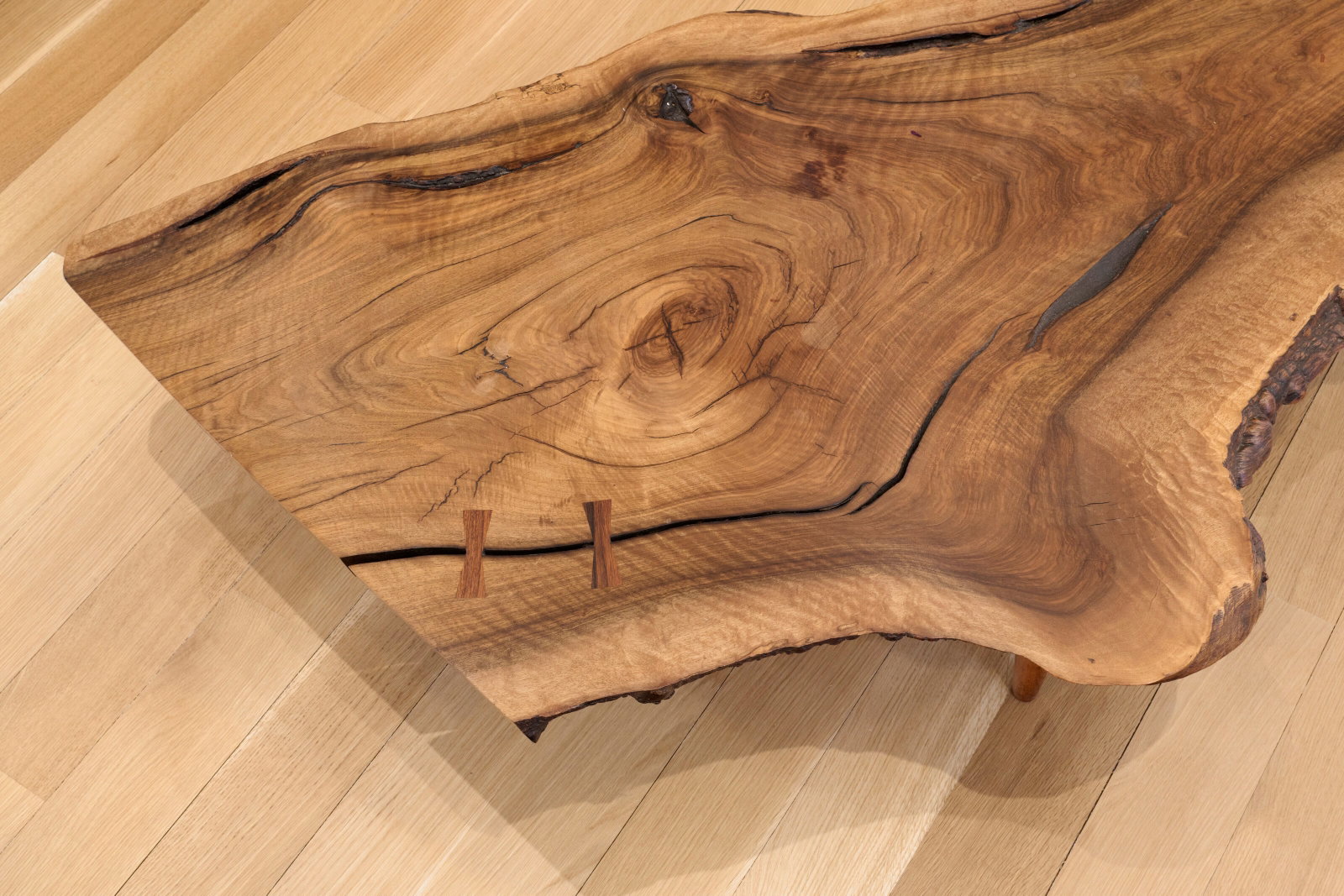 GEORGE NAKASHIMA (1905-1990) Low Table, 1958: Details GEORGE NAKASHIMA (1905-1990) Low Table, 1958 with two butterfly joints and free edges English walnut, rosewood 13 x 65 x 35 in. (33 x 165.1 x 88.9 cm) inscribed with original owner's name Prov
