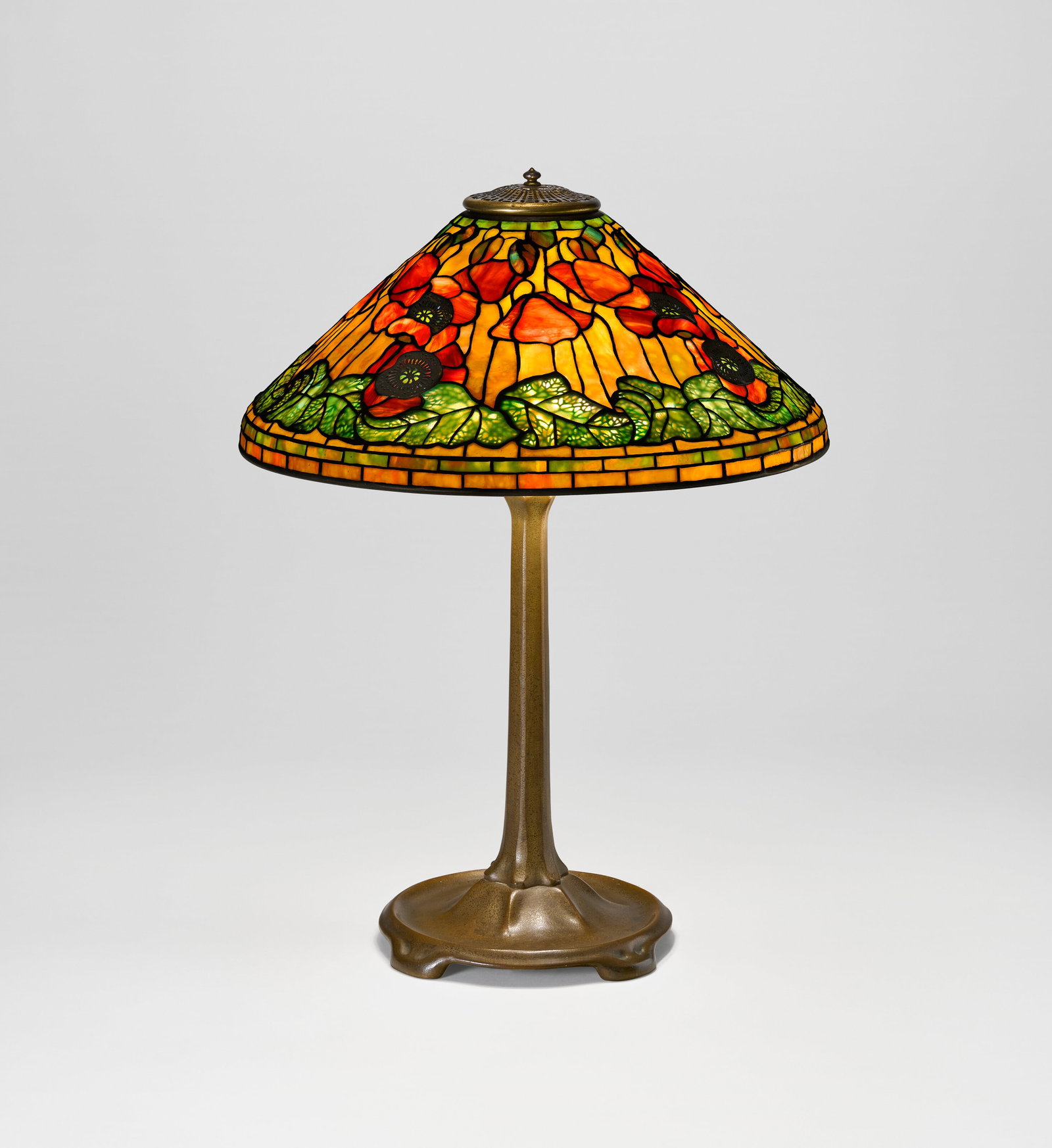 TIFFANY STUDIOS 'Poppy' Table Lamp, circa 1905: Details TIFFANY STUDIOS 'Poppy' Table Lamp, circa 1905 leaded glass, patinated bronze 27 in. (68.5 cm) high, 20 ¼ in. (51.4 cm) diameter of shade shade impressed TIFFANY STUDIOS NEW YORK 1531 bas