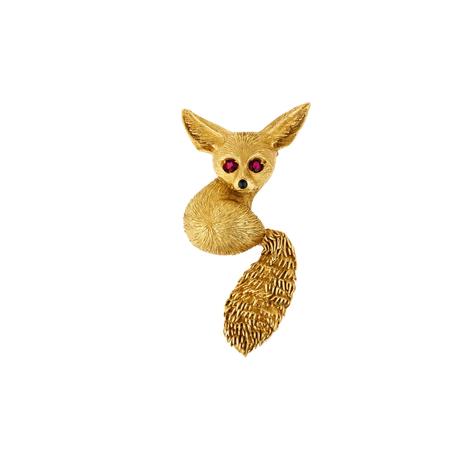 CARTIER RUBY, ONYX AND GOLD FENNEC FOX BROOCH: CARTIER RUBY, ONYX AND GOLD FENNEC FOX BROOCH Details Designed as a fennec fox, round rubies, round onyx cabochon, 18k yellow gold (French marks), circa 1955, signed Cartier, Paris, maker's mark (Soci