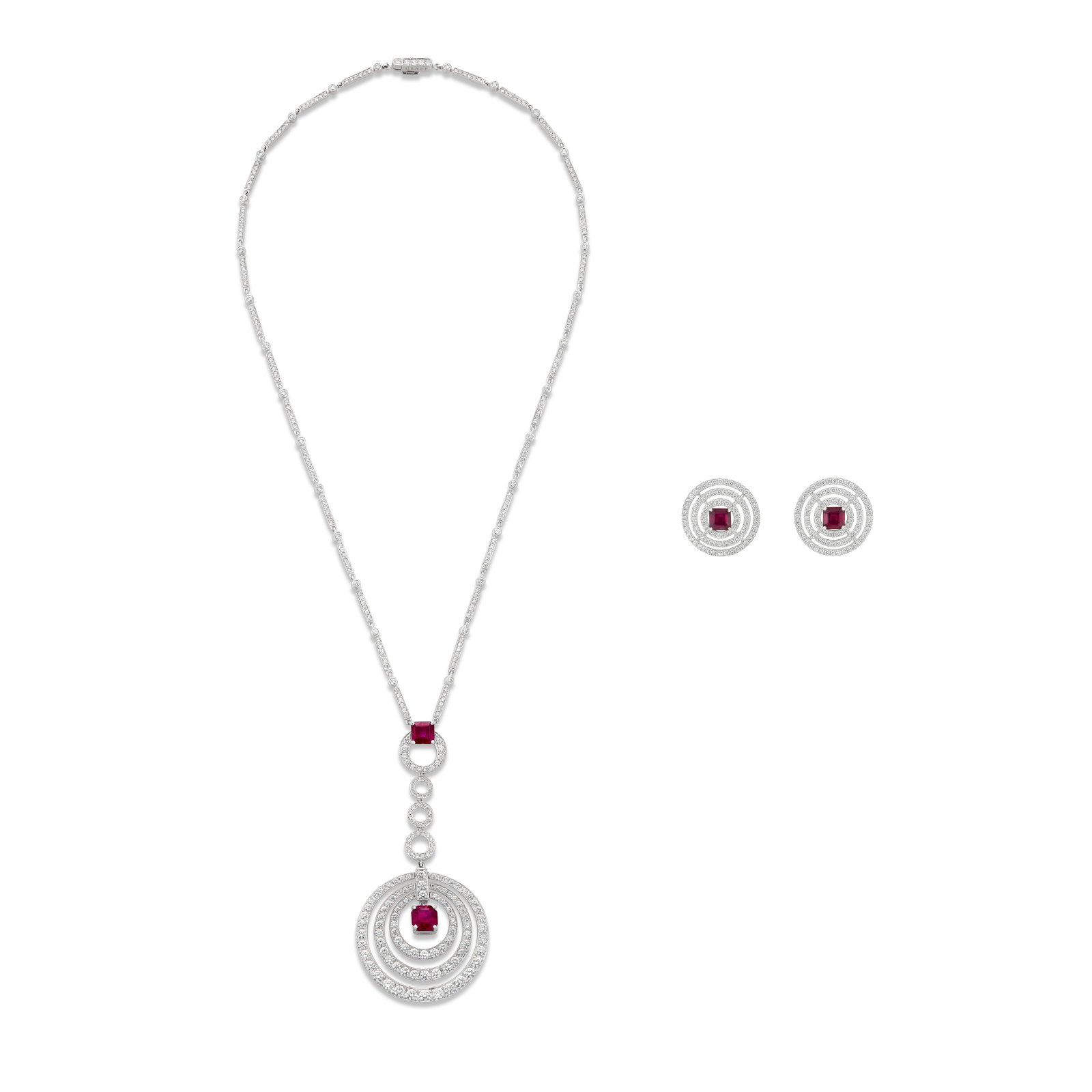 GRAFF SET OF RUBY AND DIAMOND ‘BULLSEYE' JEWELRY: Details Square-shaped rubies, round diamonds, 18k white gold, each signed Graff, each numbered Rubies (pendant-necklace): two square with an approximate total weight of 2.25 - 2.50 carats Rubies