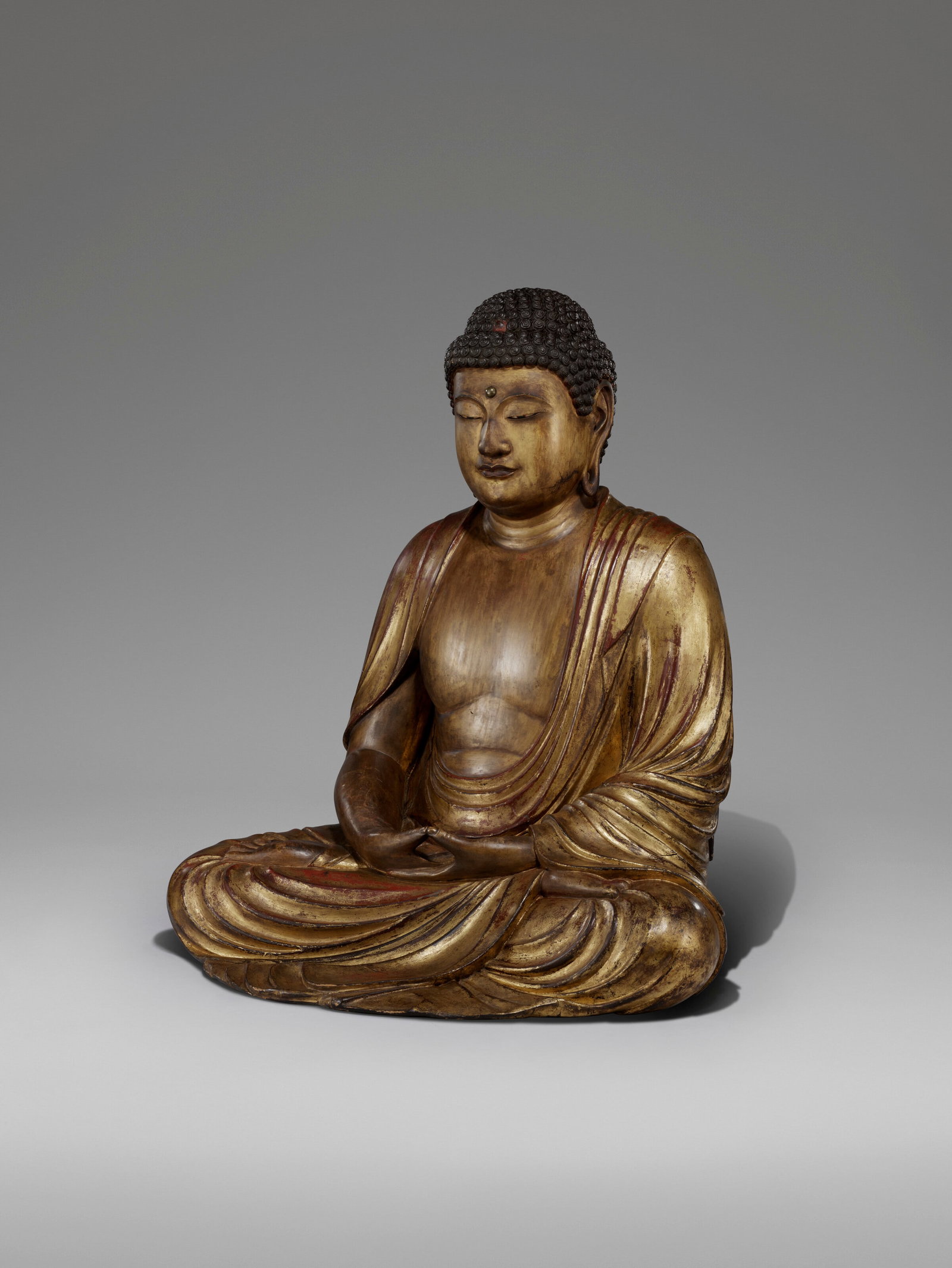 A WOOD SCULPTUE OF SHAKA NYORAI (BUDDHA SHAKYAMUNI) JAPAN, KAMAKURA-NANBOKUCHO PERIOD (14TH CENTURY) (1 of 7)
