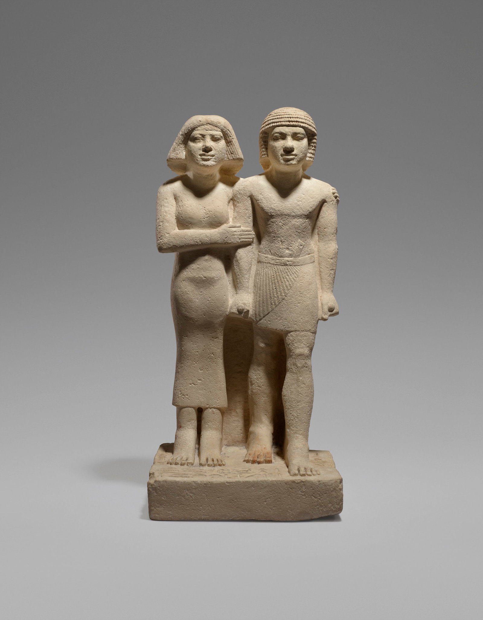 AN EGYPTIAN LIMESTONE PAIR STATUE OF THE ROYAL ACQUAINTANCES NEBEFWY AND MES-SAT OLD KINGDOM, MID TO (1 of 14)