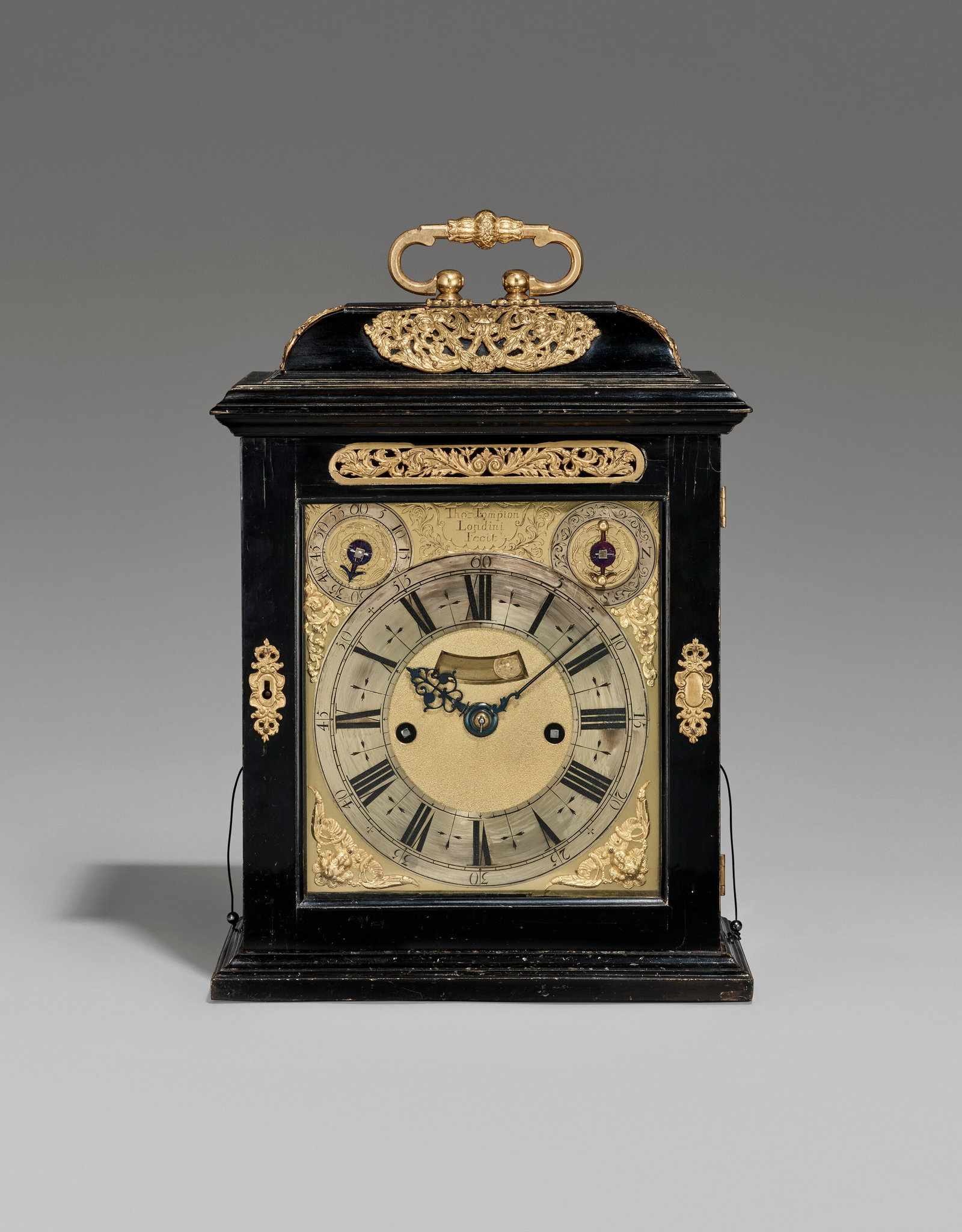 A WILLIAM AND MARY GILT-BRASS MOUNTED EBONISED STRIKING TABLE CLOCK WITH PULL QUARTER REPEAT THOMAS: Details A WILLIAM AND MARY GILT-BRASS MOUNTED EBONISED STRIKING TABLE CLOCK WITH PULL QUARTER REPEAT THOMAS TOMPION, LONDON, NO. 202, CIRCA 1692 CASE: the cushion moulded top surmounted by foliate tie