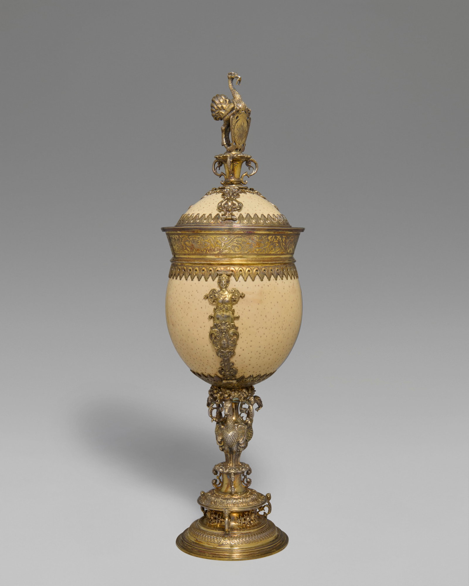 A GERMAN SILVER-GILT MOUNTED OSTRICH EGG CUP AND COVER MARK OF GEORG CHRISTOPH I ERHART (ERHARD), (1 of 8)