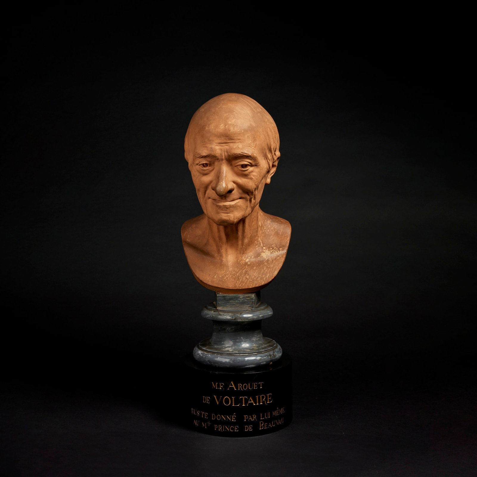 JEAN-ANTOINE HOUDON (1741-1828), 1778 Bust of François Marie Arouet, known as Voltaire: Details JEAN-ANTOINE HOUDON (1741-1828), 1778 Bust of François Marie Arouet, known as Voltaire (1694-1778) terracotta, signed and dated at the back "houdon f 1778", on a bleu turquin marble base,