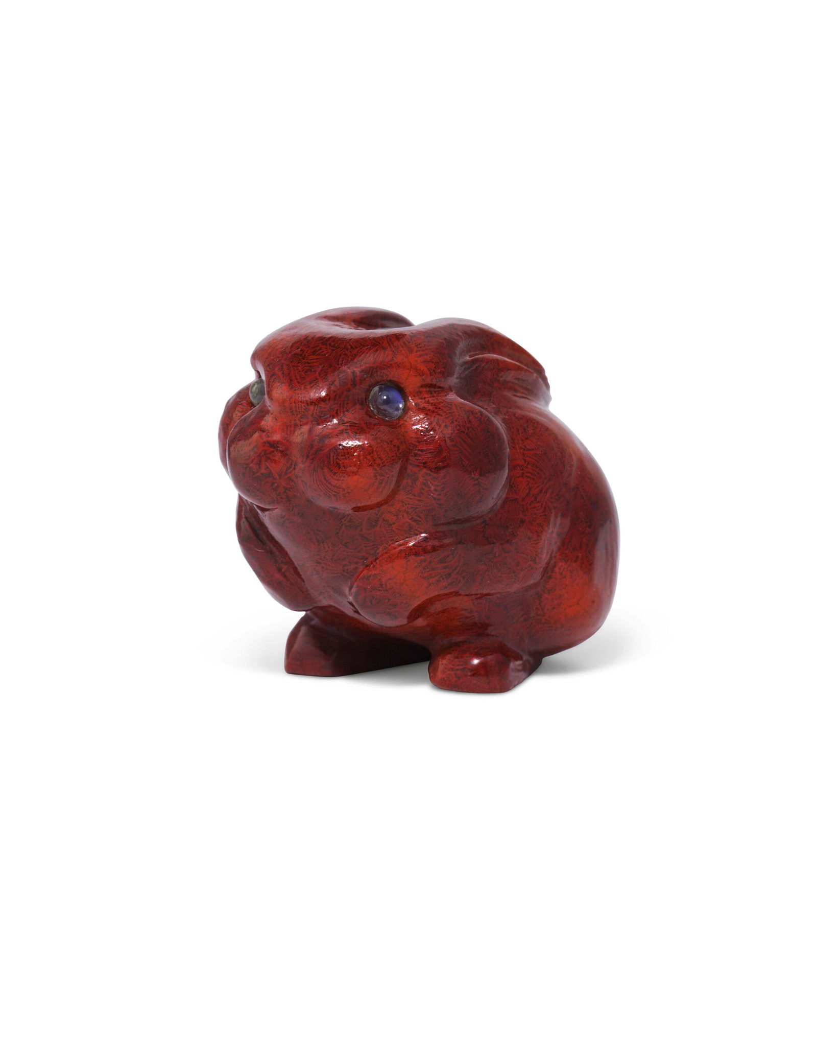 A RARE GEM-SET PURPURINE MODEL OF A RABBIT BY FABERGÉ, ST PETERSBURG, CIRCA 1900: Details A RARE GEM-SET PURPURINE MODEL OF A RABBIT BY FABERGÉ, ST PETERSBURG, CIRCA 1900 Stylistically carved crouching, with its front feet raised, with cabochon moonstone eyes, apparently unmar