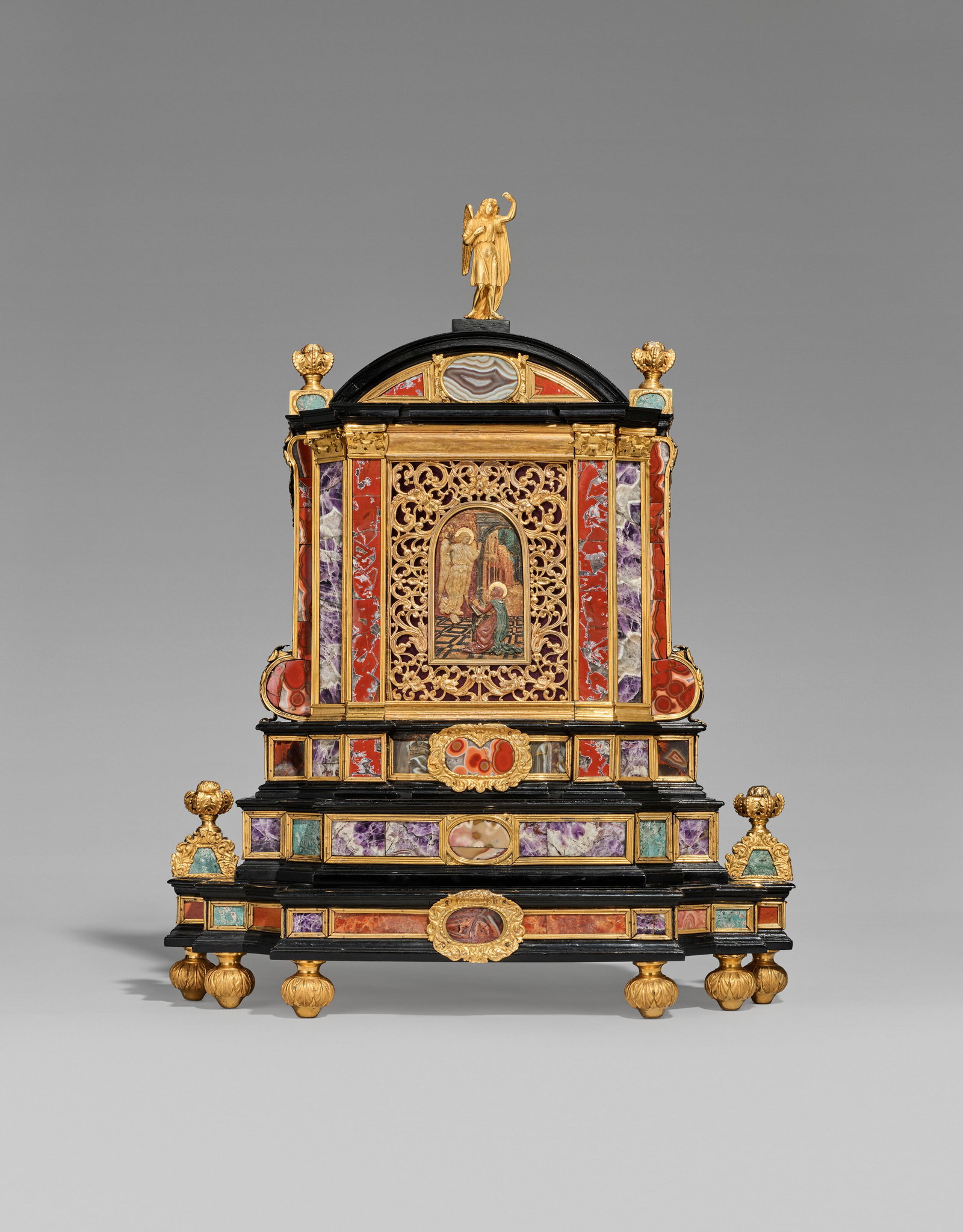 A BOHEMIAN GILT-BRONZE-MOUNTED PIETRA DURA, WAX AND EBONY HOUSE ALTAR PRAGUE, FIRST QUARTER 17TH: Details A BOHEMIAN GILT-BRONZE-MOUNTED PIETRA DURA, WAX AND EBONY HOUSE ALTAR PRAGUE, FIRST QUARTER 17TH CENTURY The arched cresting inset with an onyx medallion, flanked by jasper panels, the angles 