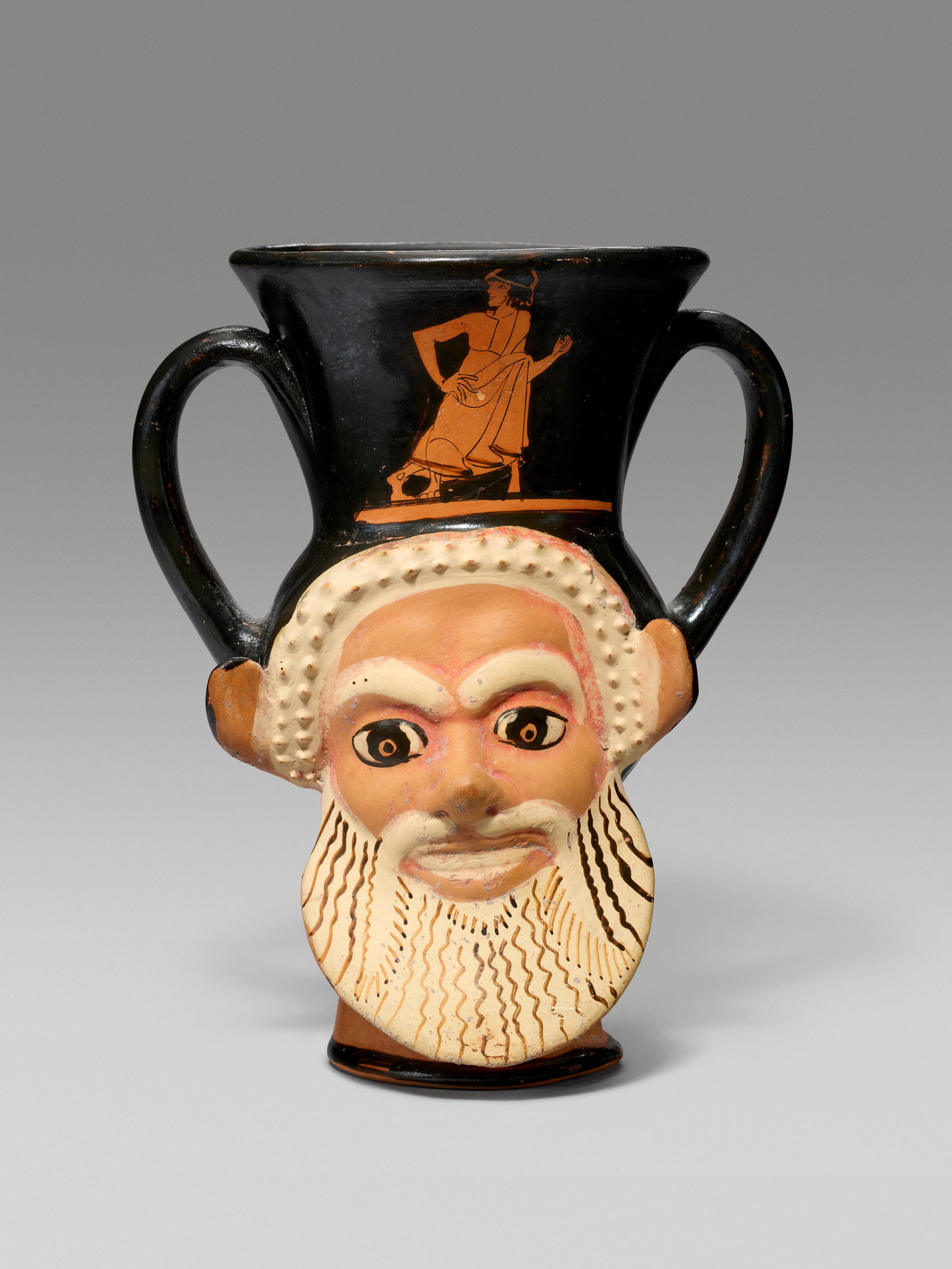 AN ATTIC RED-FIGURED JANIFORM KANTHAROS ATTRIBUTED TO THE SABOUROFF CLASS, CIRCA 470 B.C. (1 of 2)