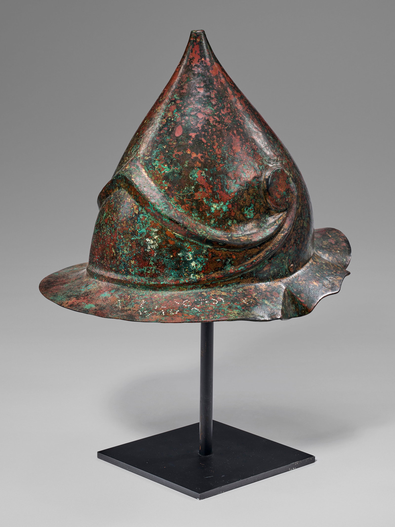 A GREEK BRONZE HELMET OF BOEOTIAN TYPE MAGNA GRAECIA, HELLENISTIC PERIOD, CIRCA 3RD-2ND CENTURY B.C. (1 of 4)