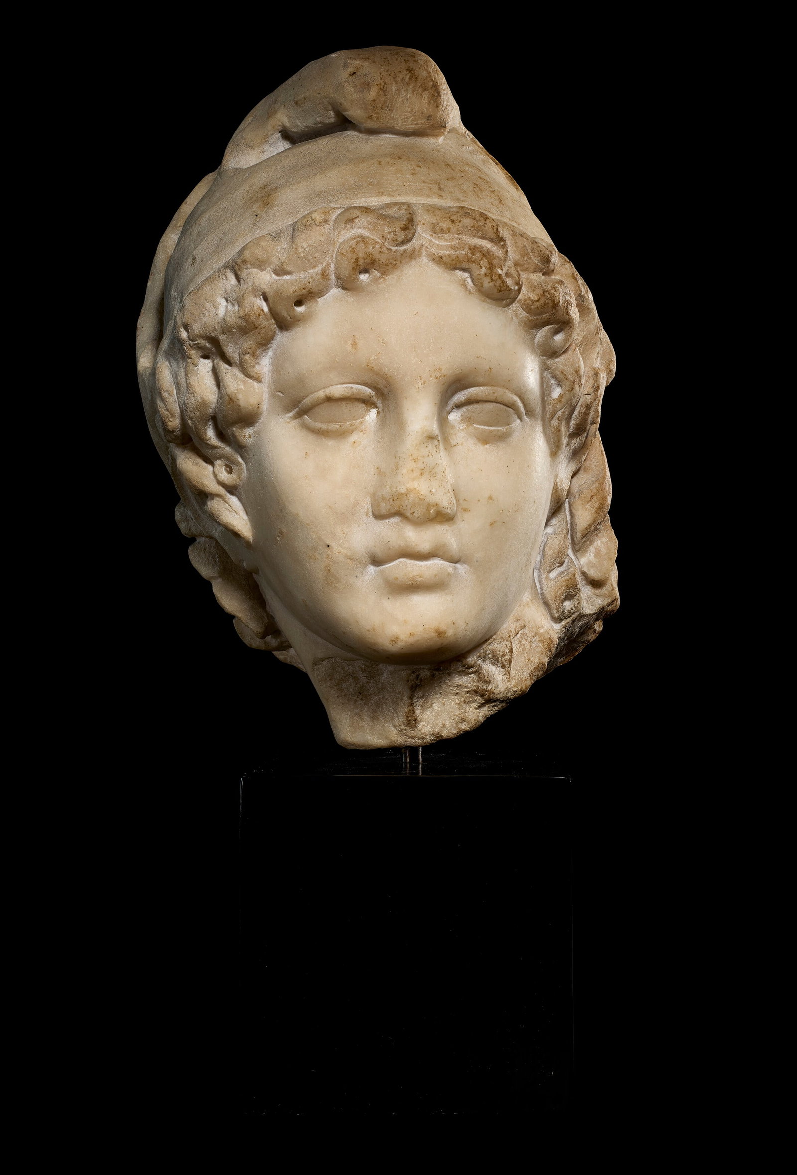 A ROMAN MARBLE HEAD OF GANYMEDE CIRCA 1ST CENTURY A.D. (1 of 4)