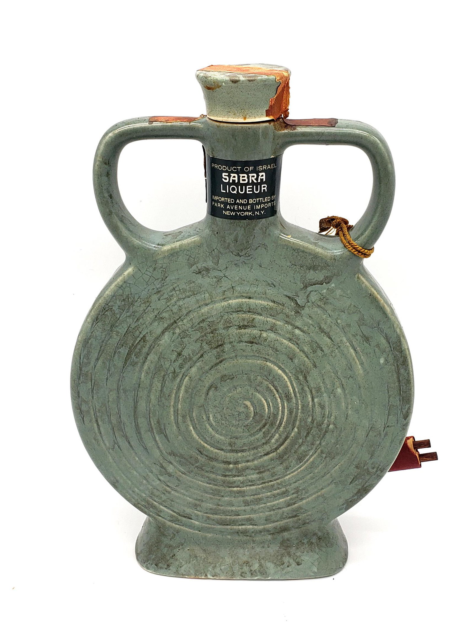 Vintage Ceramic & Stoneware Liquor Decanter By Sabra!: A vintage ceramic & stoneware green decanter with chocolate liquer made in Israel by Sabra and Imported and botteled by Park Avenue imports New york N.Y,attached a scroll describing the history of the