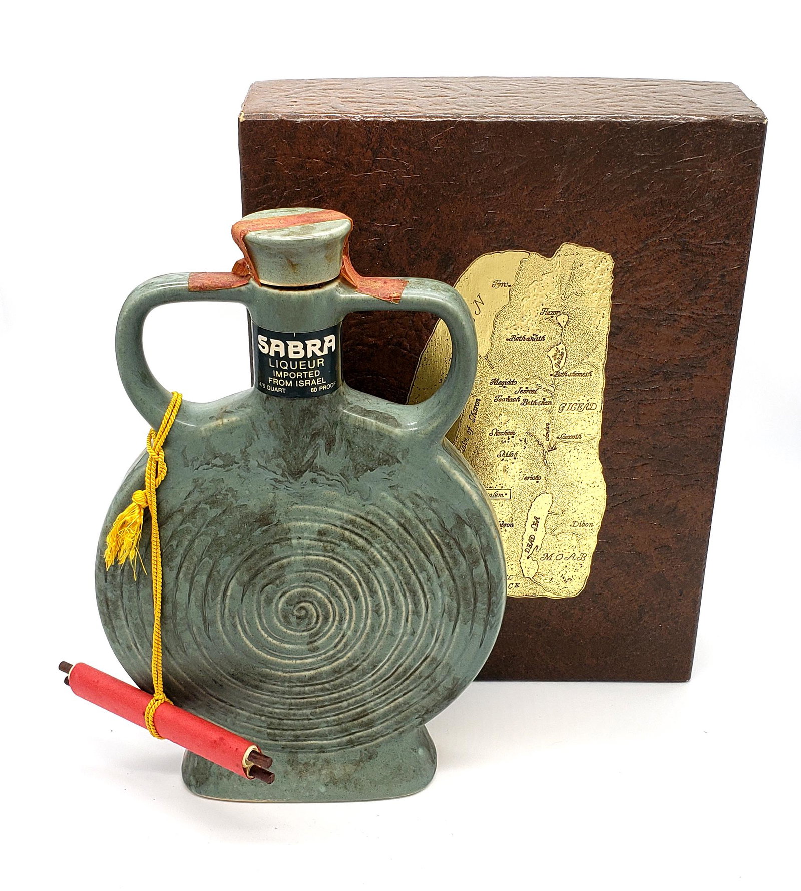 Vintage Ceramic & Stoneware Liquor Decanter By Sabra!: A vintage ceramic & stoneware green decanter with chocolate liquer made in Israel by Sabra and Imported and botteled by Park Avenue imports New york N.Y,attached a scroll describing the history of the