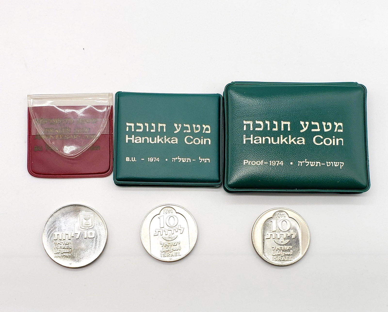 Lot Vintage Three Israel 10 Lirot coins.500-.900: Lot 1974 10 Lirot coins Hanukkah Coin 10 Lirot Proof and regular Uncirculated In Green Display Holder Minted at the government Mint, Jerusalem Israel silver.500 nice Damascus menorah on the back of th