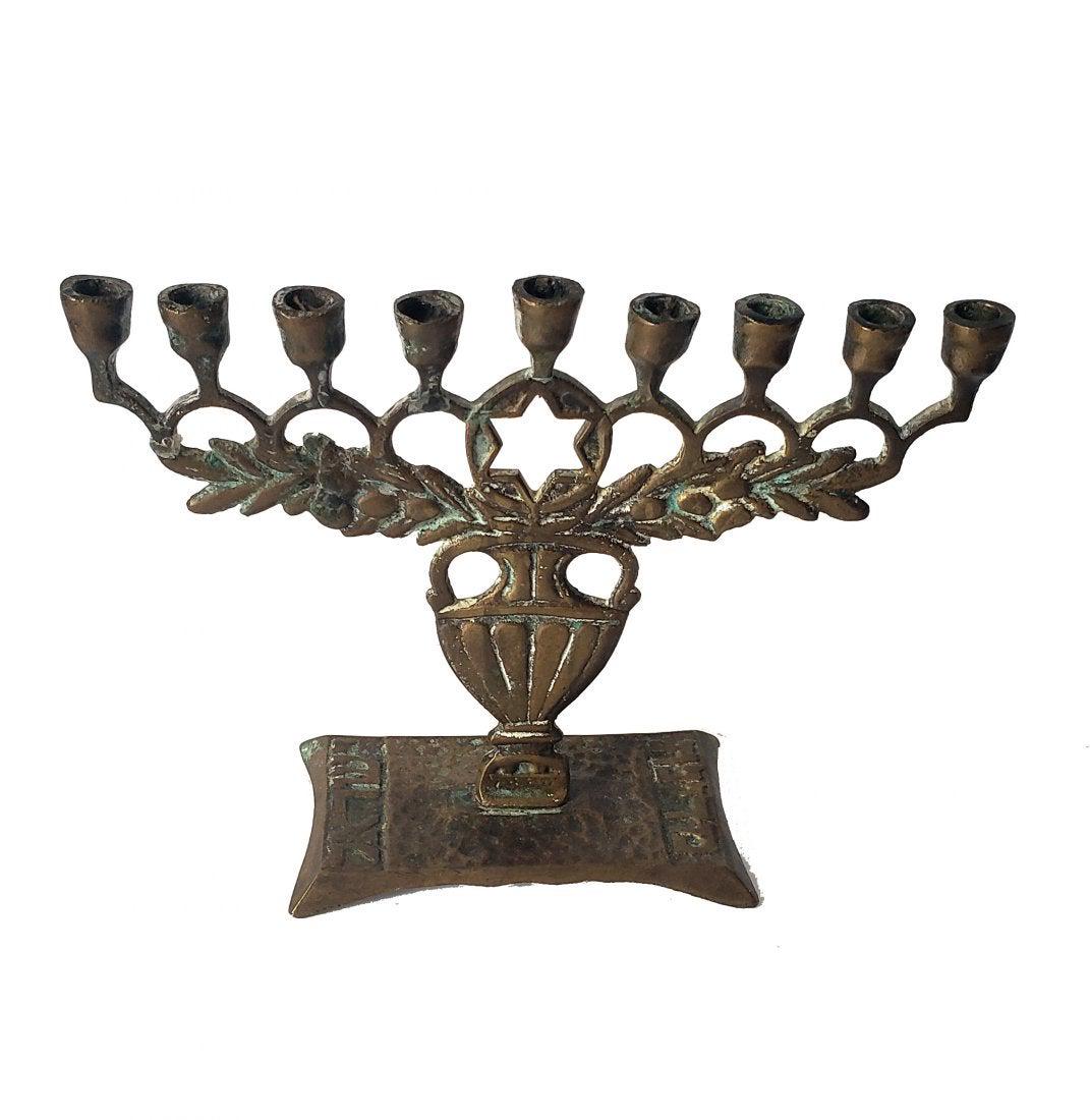 Vintage Olive Branches Menorah Israel 1950s!: Vintage Olive Branches Menorah Israel 1950s, with build-up green patina!olive branches on top of an oil jug (as the oil is pouring into the jug), with a cutout Star of David in the center,on the sides