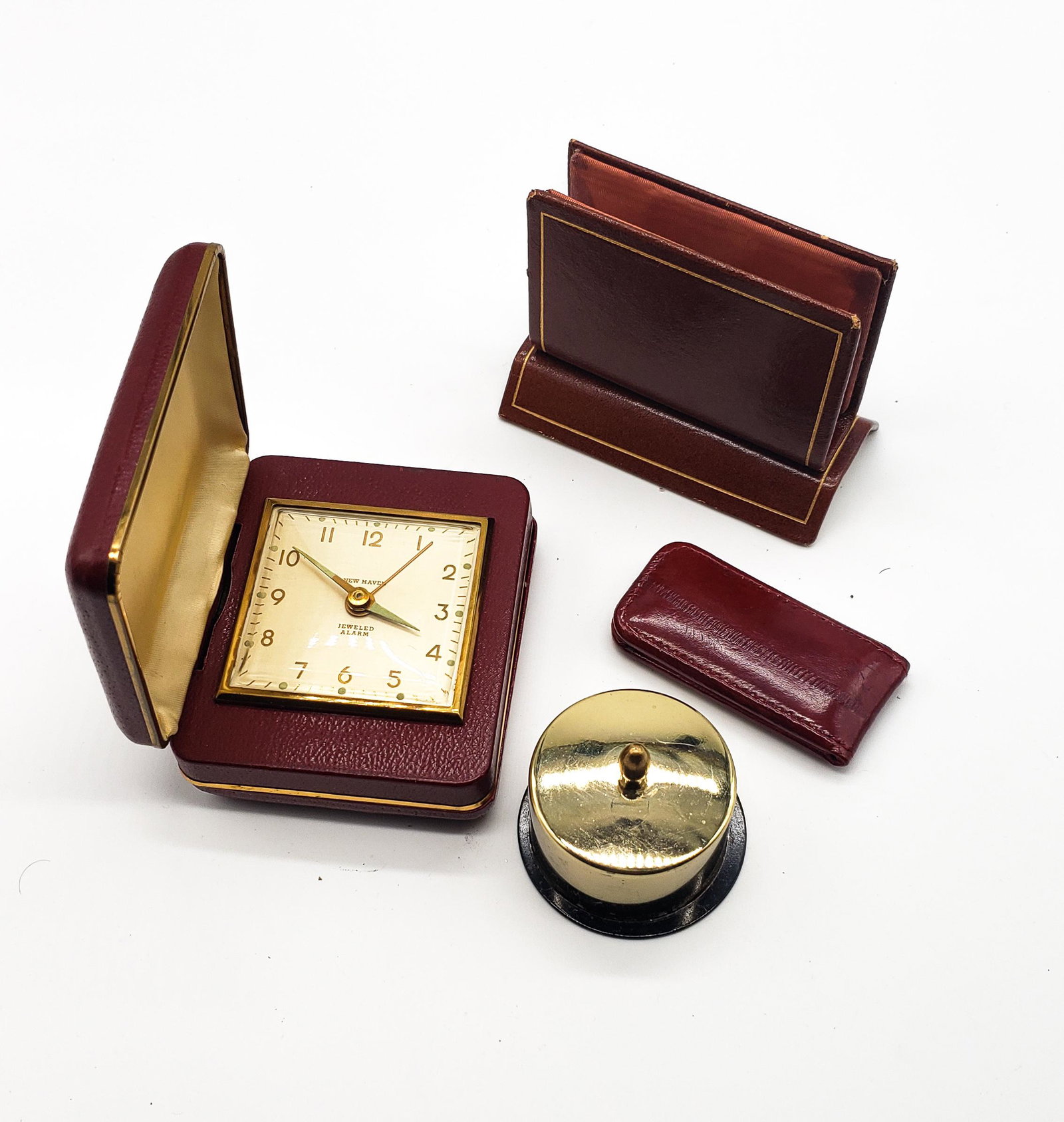 Vintage Collectible Lot #0198!: Vintage collectible's lot, new haven wind up alarm in leather case, works but hard to move buttons, leather letter & card holder, leather magnetic bill holder, gold toned metal stamps' dispenser., all