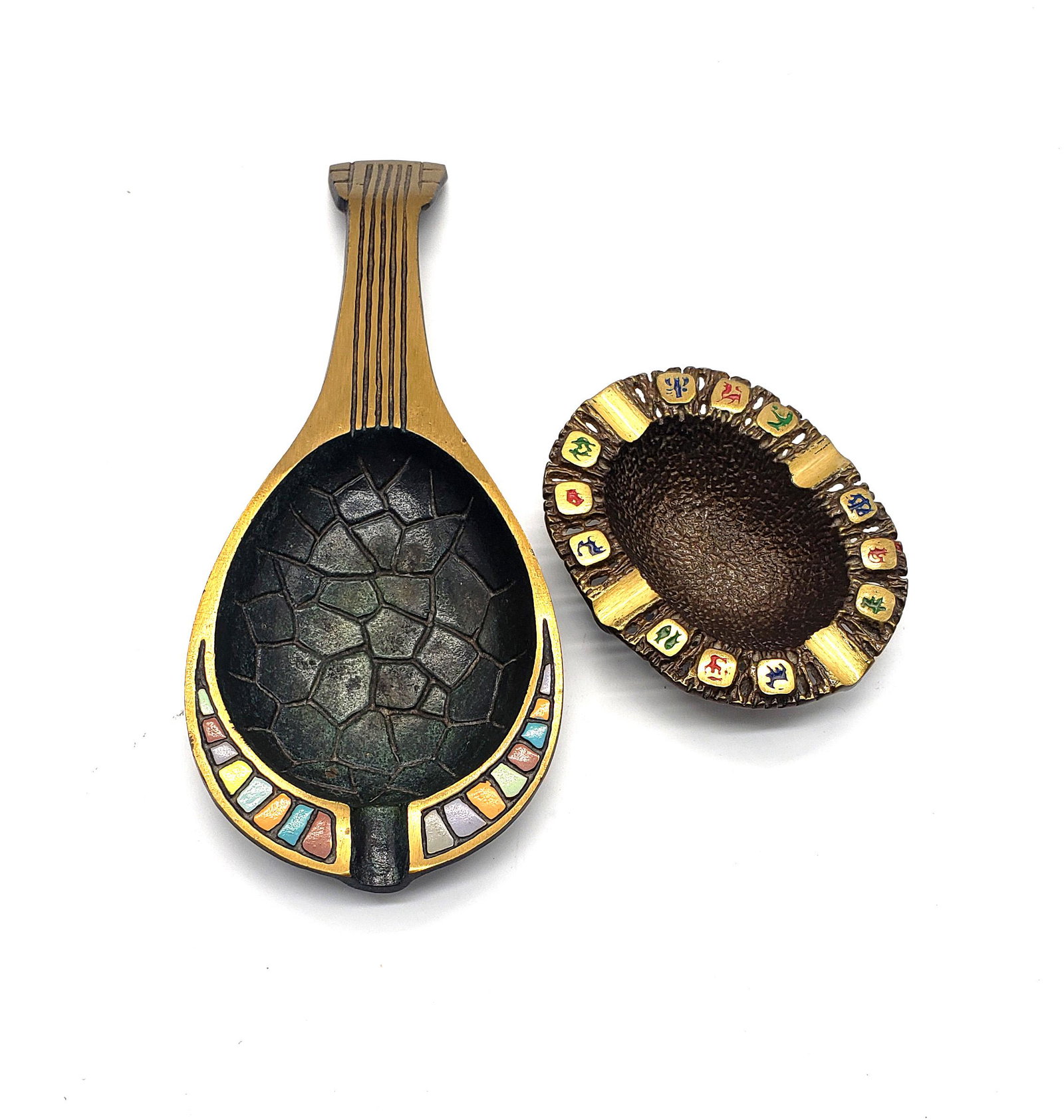 Vintage Israeli Brass Ashtrays: Vintage collectible lovely Israeli made ashtrays by Dayagi and Chen Holon. One in the shape of violin with enamel painted colors.One ashtray with zodiac painted symbols around the edges. Please look a