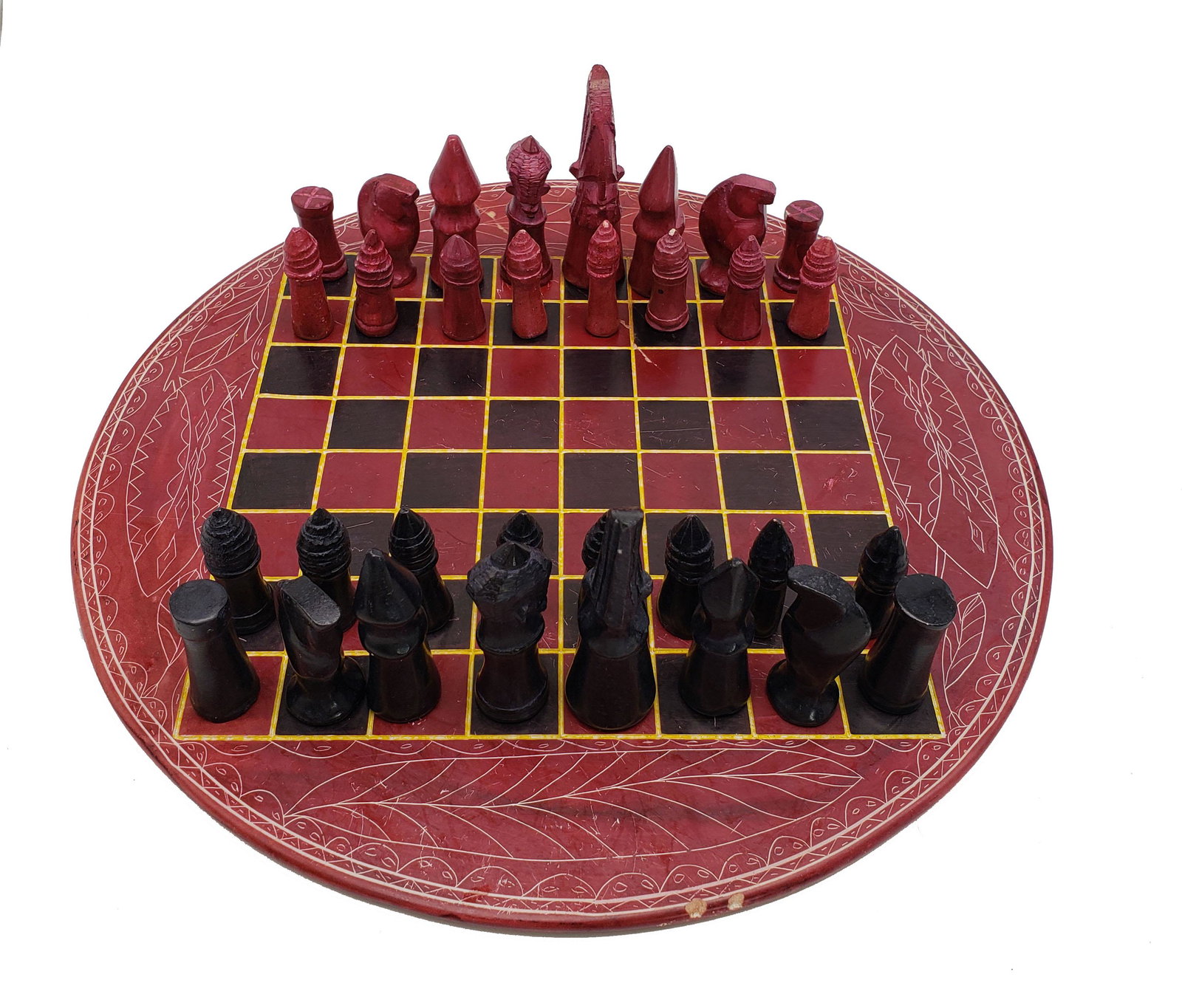 Soapstone African Chess Set - Round: A very nice African chess set made out of soapstone and round boards, no missing pieces.minor chips on stones, broken piece of board was glued, and holds strong.Board measures 12"D, pieces 1-3". Pleas