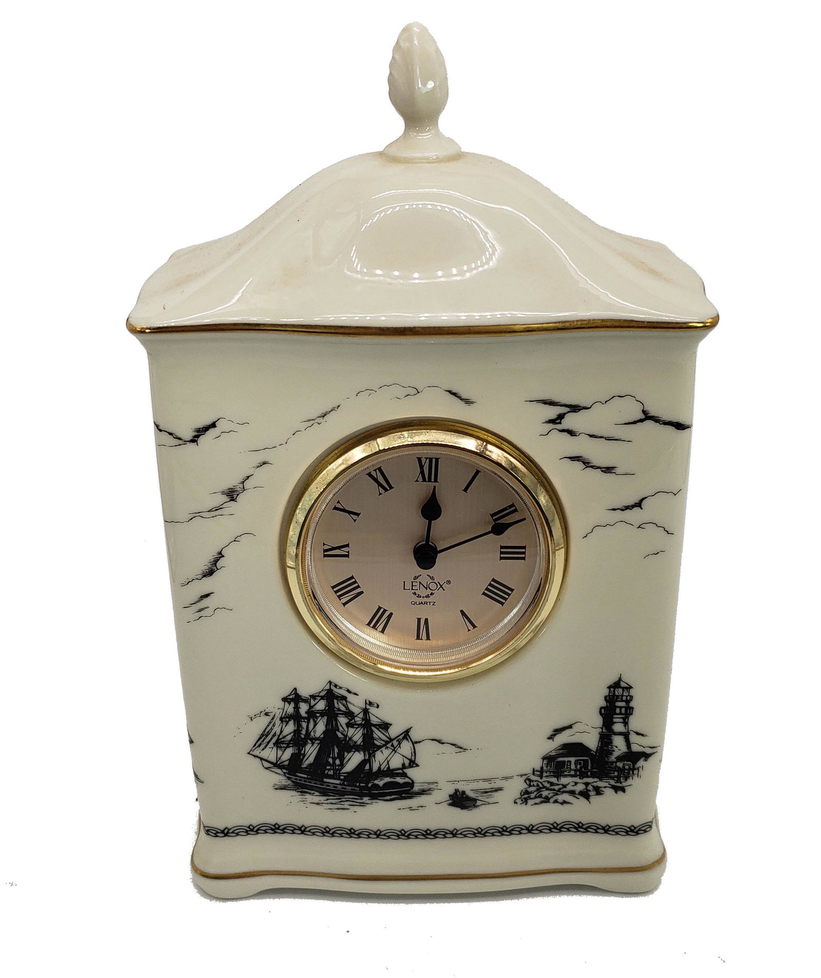 Lenox Porcelain Scrimshaw Pattern Mantel Clock: A beautiful Lenox porcelain case mantel clock, with a scrimshaw pattern and golden trim, made in the USA by Lenox China. Ivory Cream Color, measures 9 1/2" x 5 1/4" x 2 3/4",in excellent condition wit