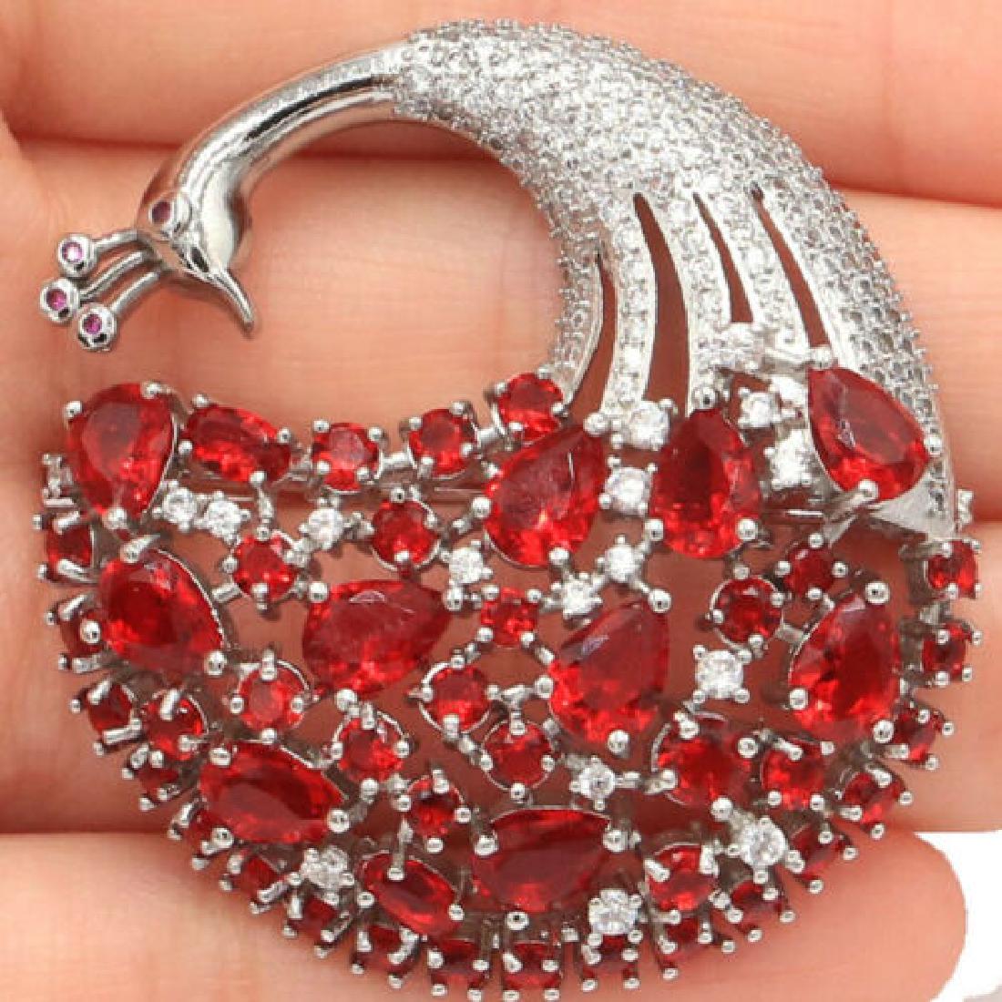 14g Peacock Red Ruby 925 Sterling Silver Brooch: Face Brooch:43x42 mm or 1.75x1.7 inch Gemstone size:7x5, 5x3, 3x3mm Clarity: IF to VVS Unit of item: 1 Piece Others: Elegant, simply and beautiful!! Luster: Attractive