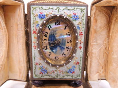 French Eight Day time only boudoir clock: French Eight Day time only boudoir clock in guilloche enamel case, decorated with pastel colored flowers, and having an enamel dial with Arabic numerals. One of the Amethyst feet has a small chip whic