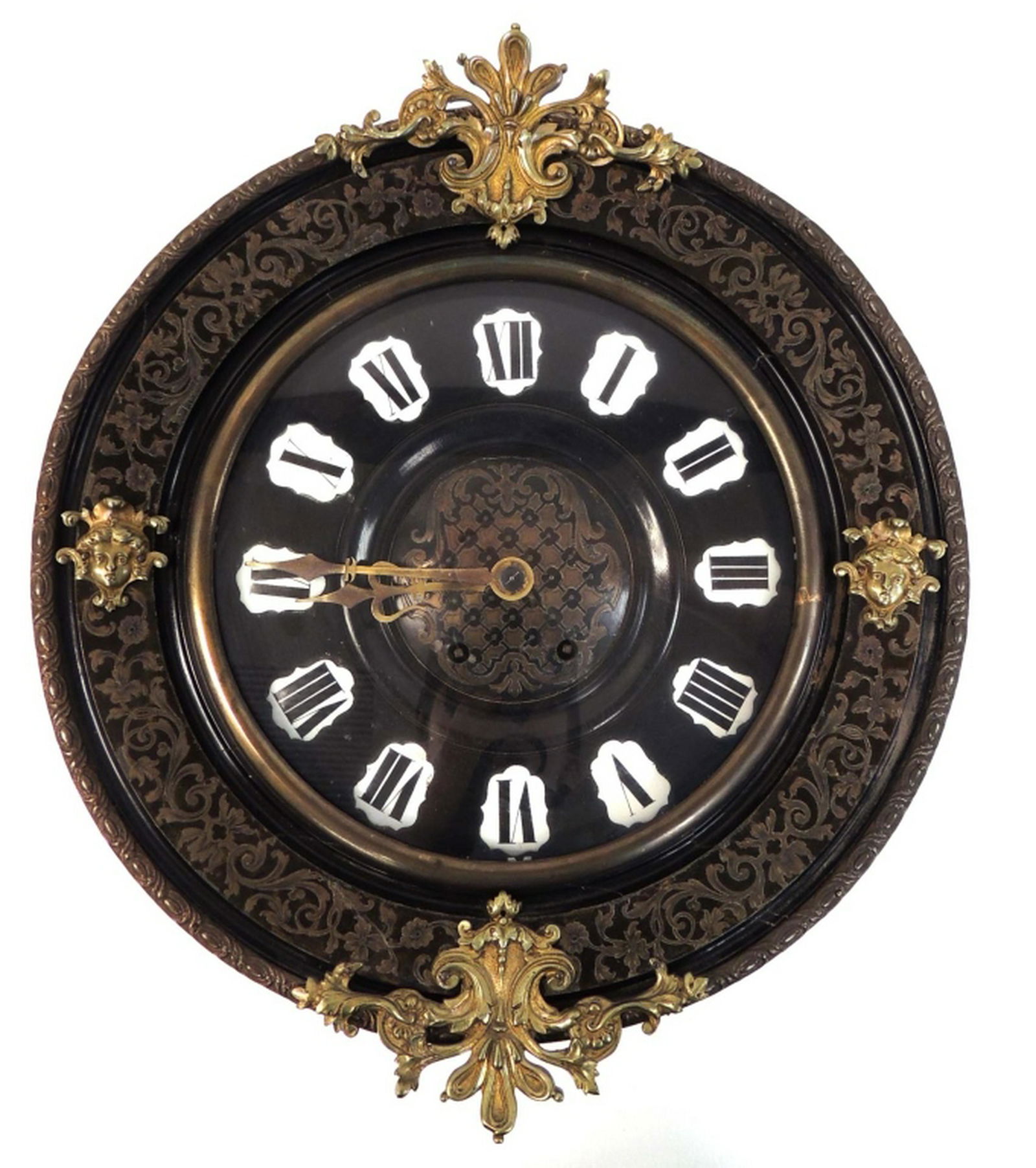 French Eight Day wall clock: French Eight Day time and strike pendulum wall clock with round ebonized wood, ormalu mounted case, inlaid with brass floral meander; the brass inlaid dial is surrounded with white enameled roman nume