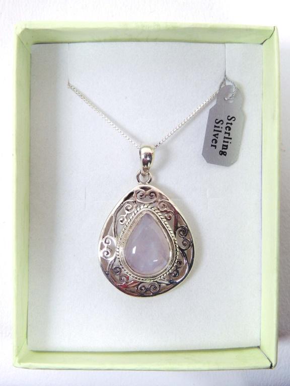 Filigree silver pendant w/ moonstone (20" chain): Filigree sterling silver pendant with a natural moonstone. Includes 20 inch sterling silver chain.