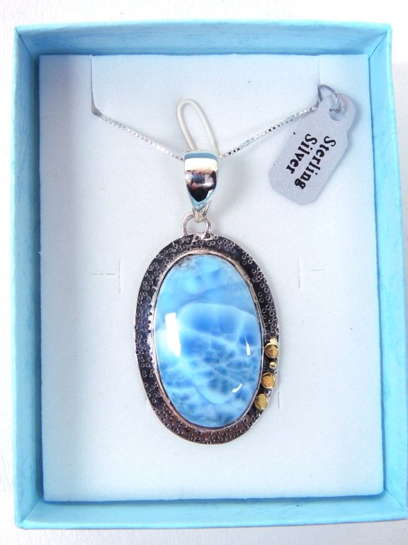 Necklace - Larimar in Sterling Silver Pendant: Popular Larimar Cabochon (only mined in the Dominican Republic) set in a sterlng silver pendant with a 20" sterling silver chain. New in a gift box. Nice turtlebacking!